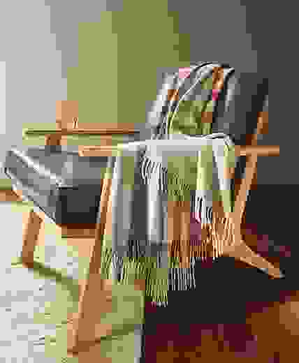 detail of audrey throw blanket draped on sanna chair.