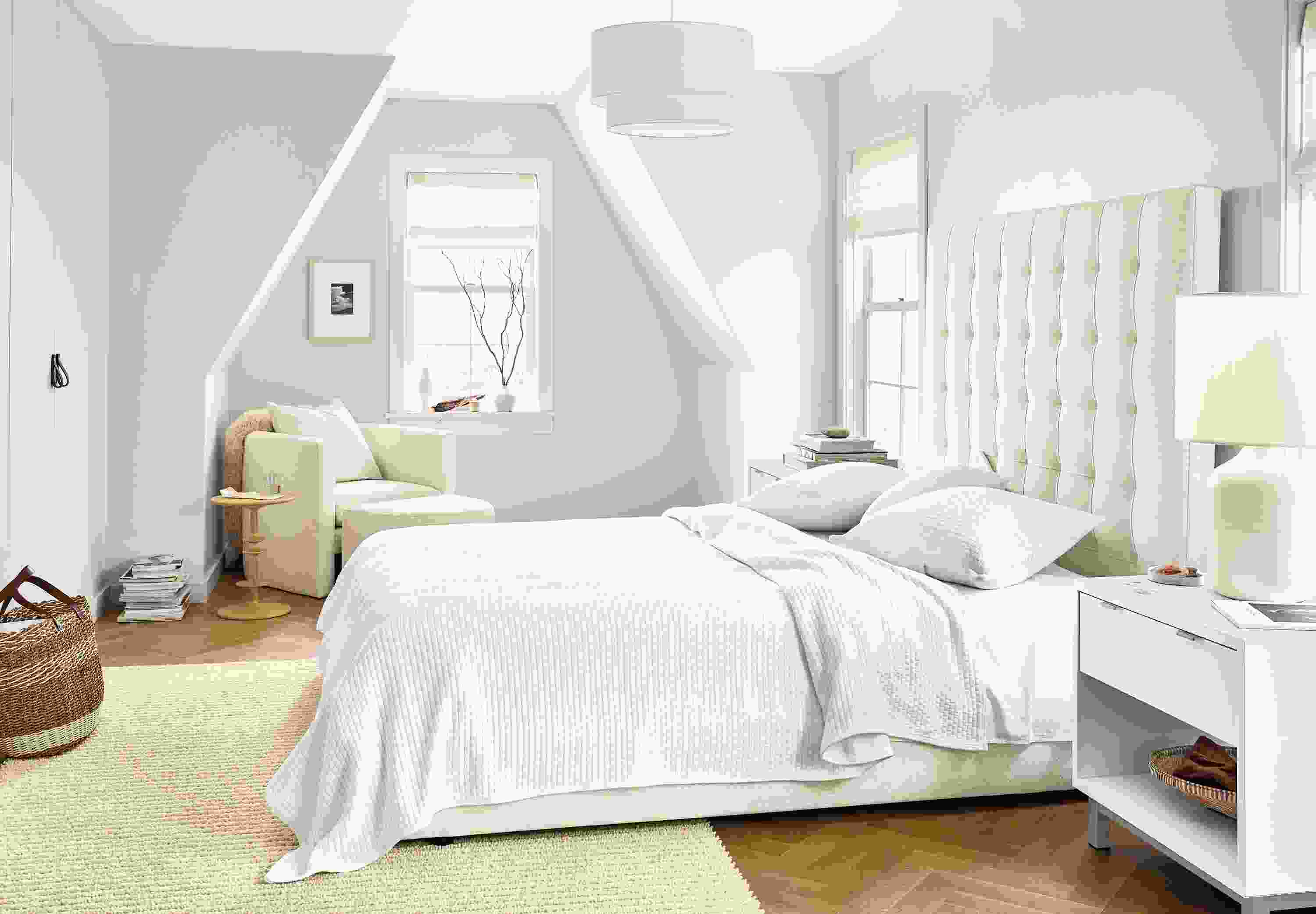 Detail of Avery queen storage bed in Sumner Ivory fabric in large bedroom.