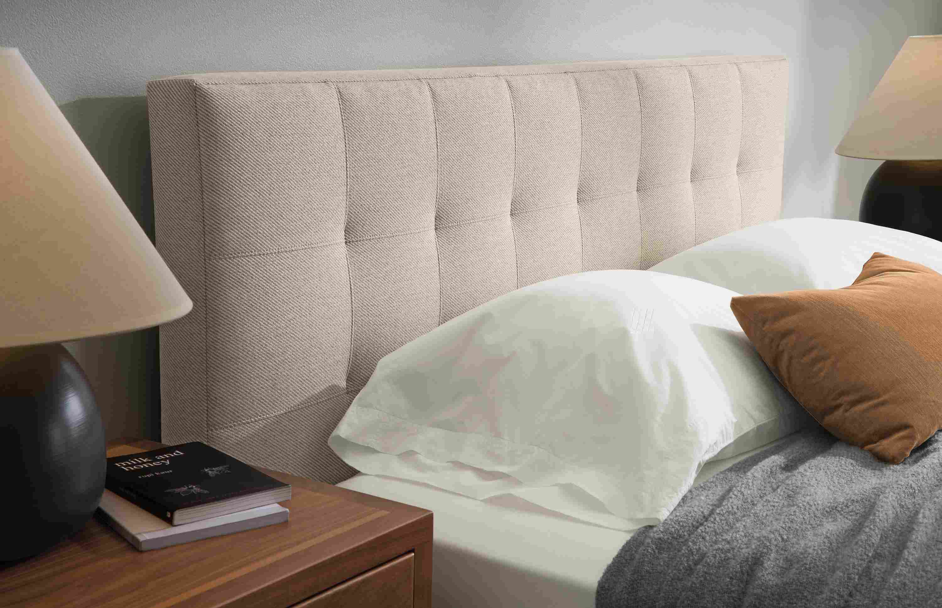 Bedroom of Avery queen bed in Derry Flax, Berkeley nightstand in walnut and 2 Elsie table lamps in coal.