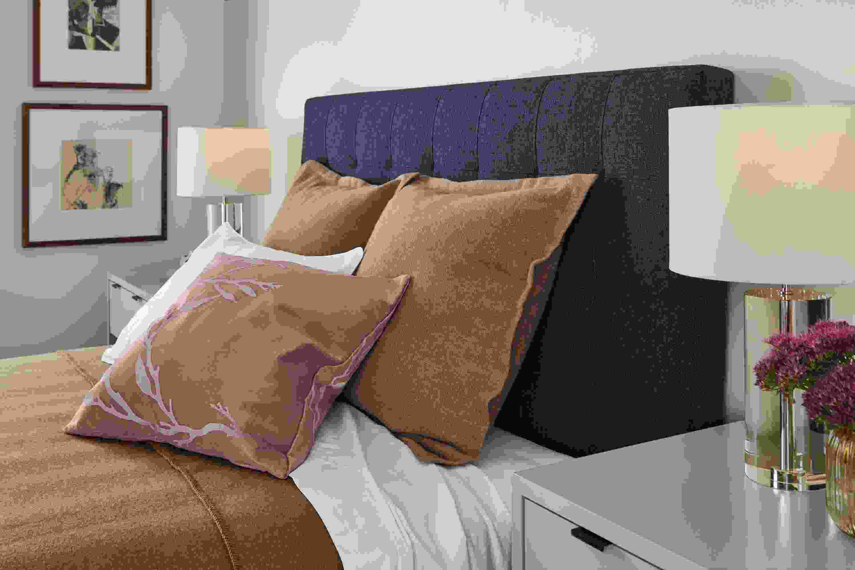 Detail of Avery Queen Bed in Sumner Navy fabric with Alexa crystal table lamps.