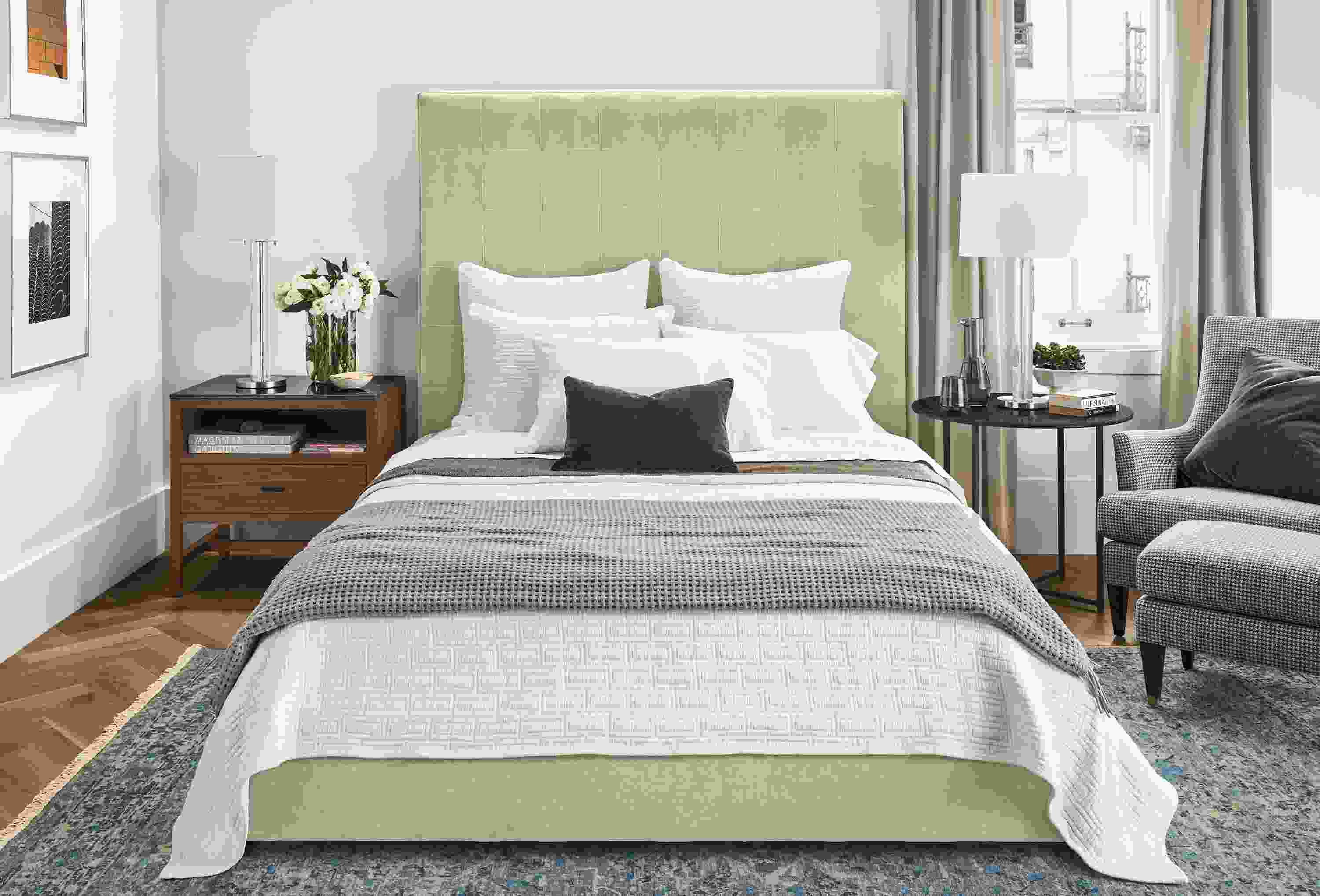 Detail of Avery queen storage bed with high headboard in Banks Natural velvet fabric in Luxury bedroom.