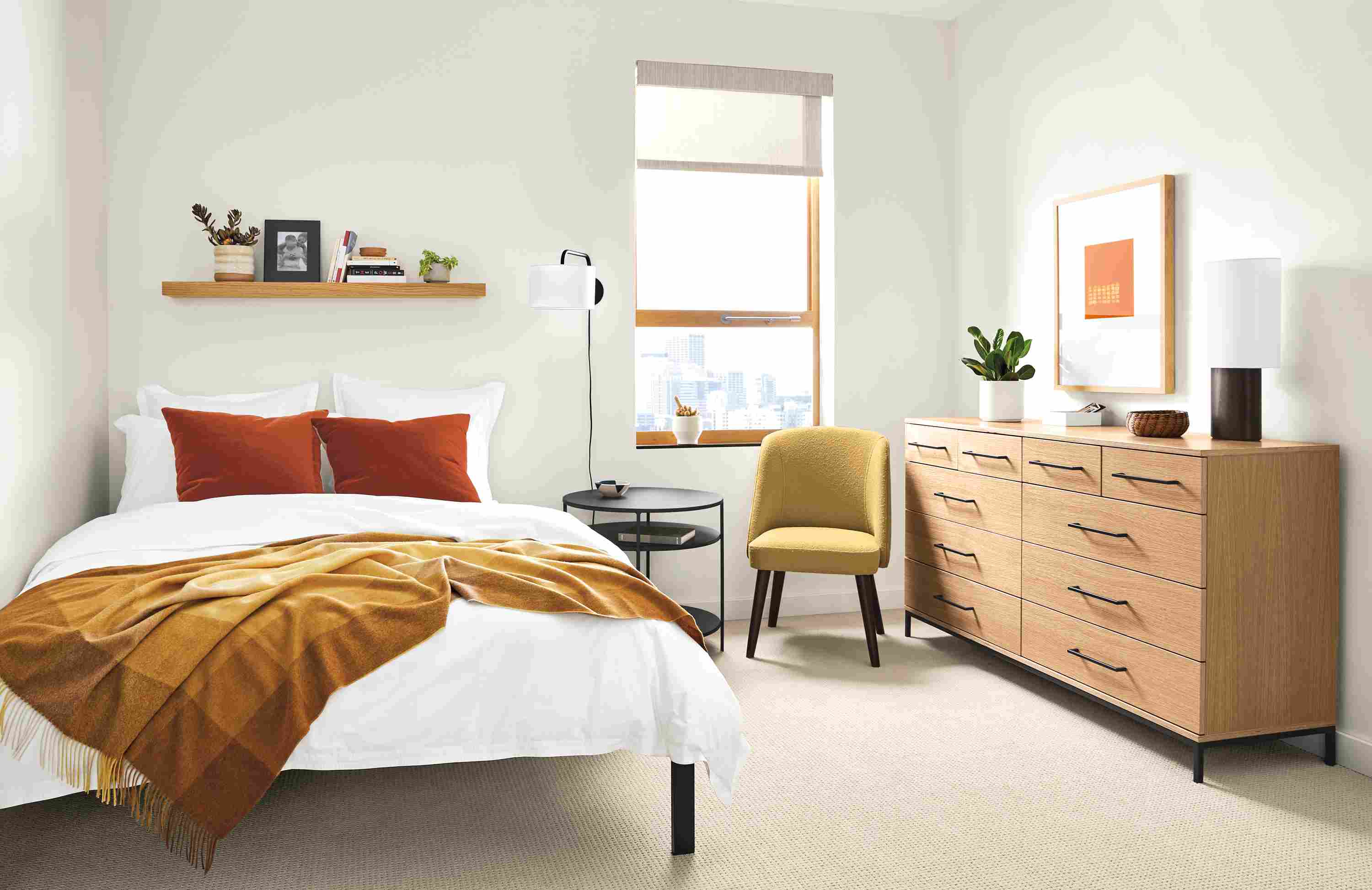 Detail of Baker 10-drawer dresser in small bedroom.