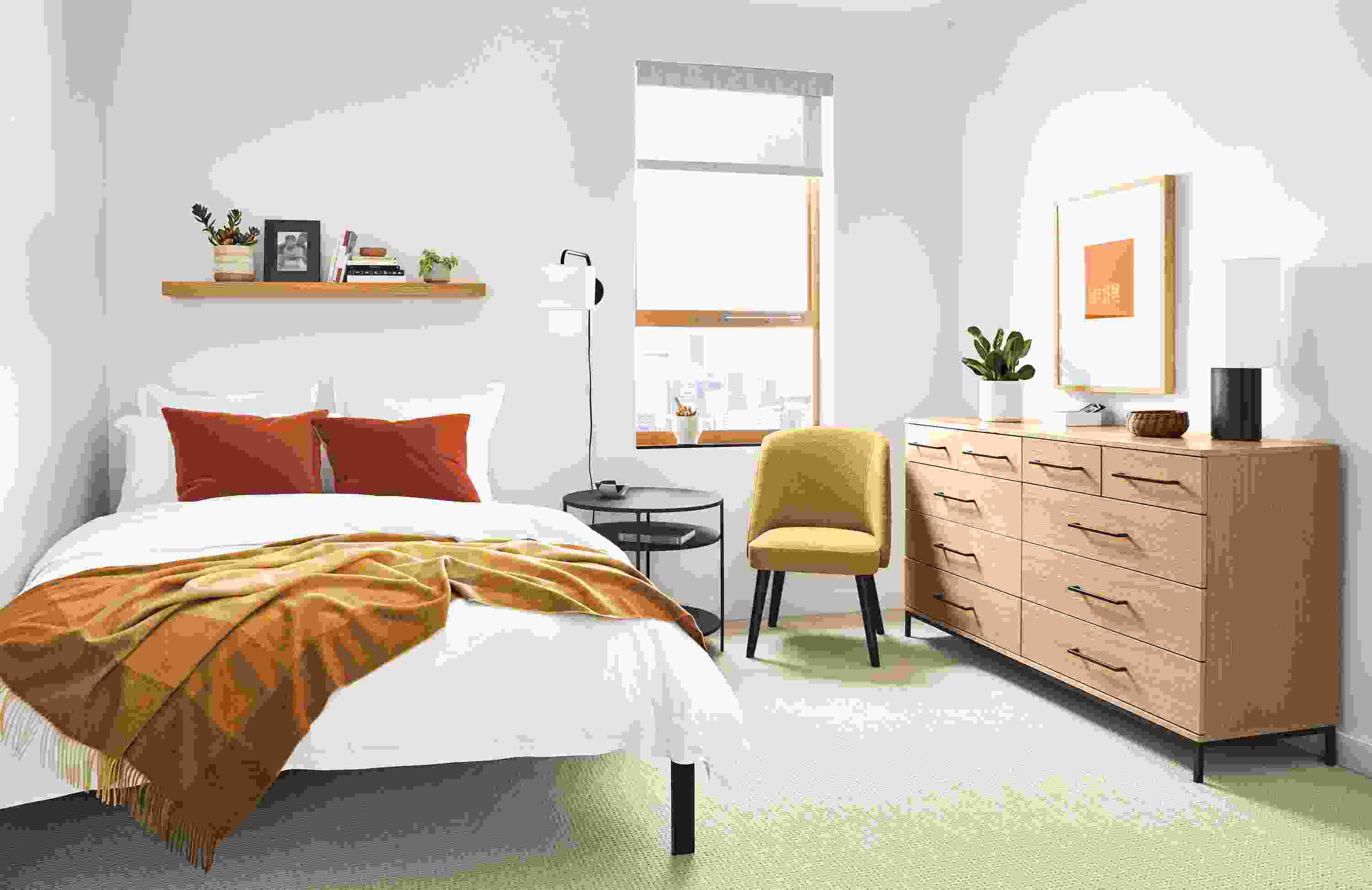 Detail of Baker 10-drawer dresser in small bedroom.