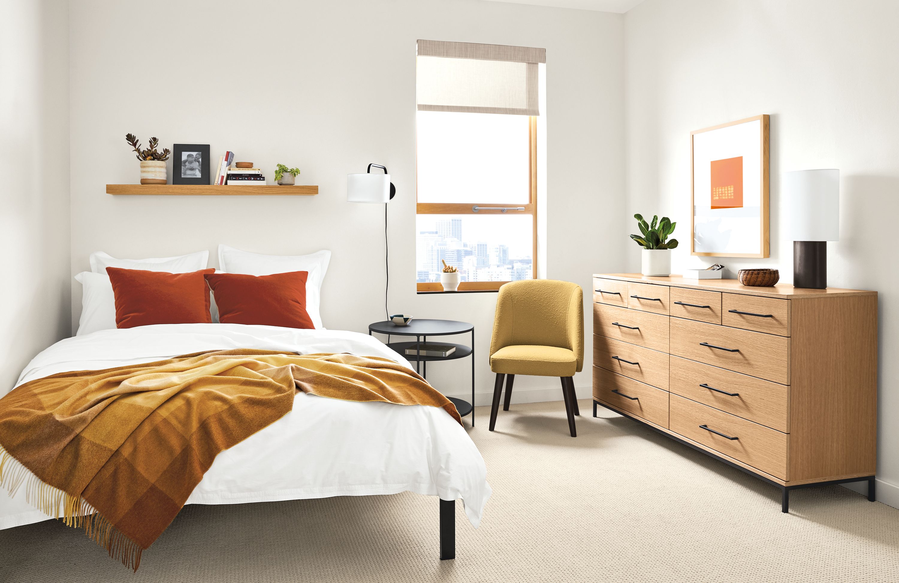 Detail of Baker 10-drawer dresser in small bedroom.