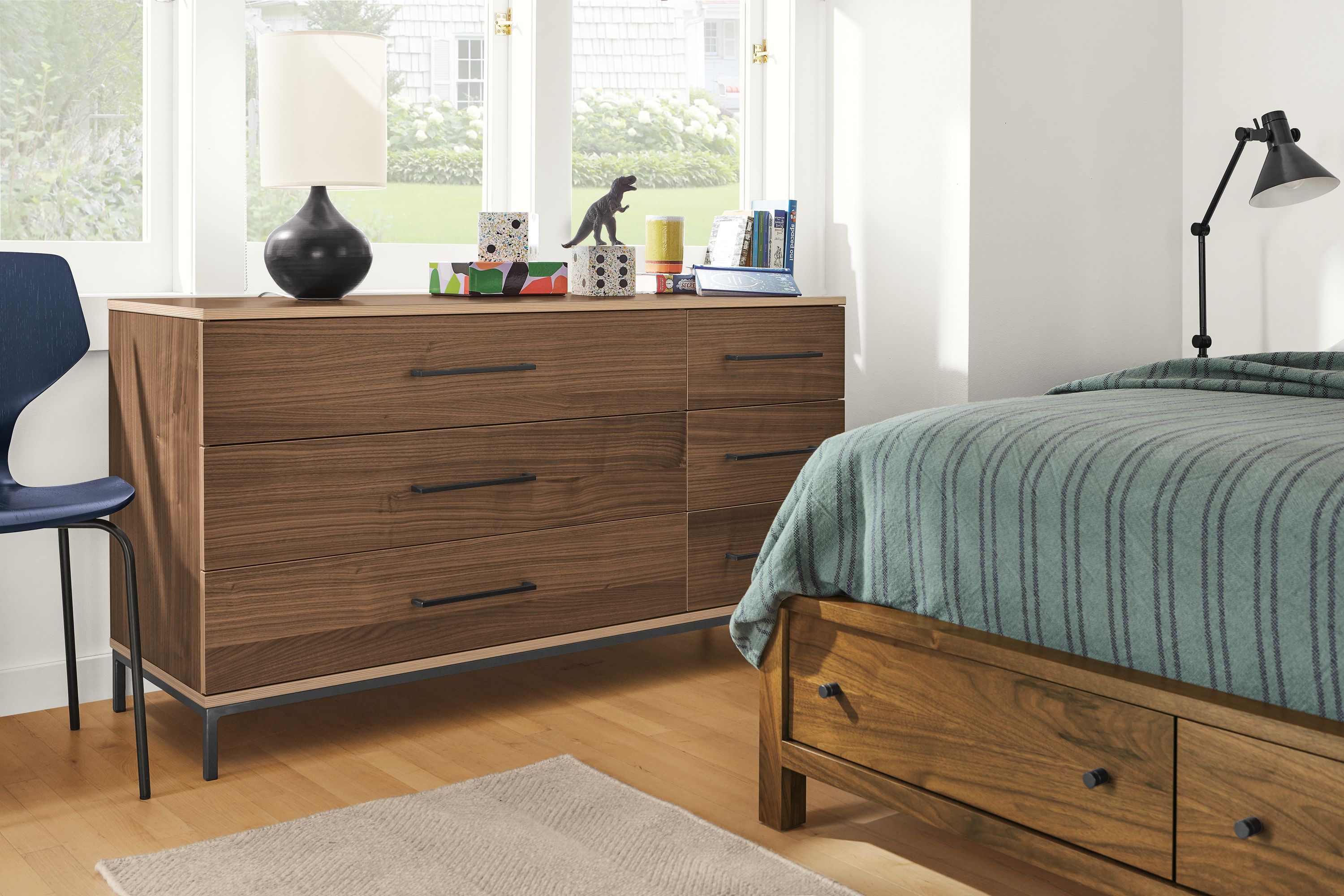 Detail of Baker 6-drawer dresser in walnut in bedroom.