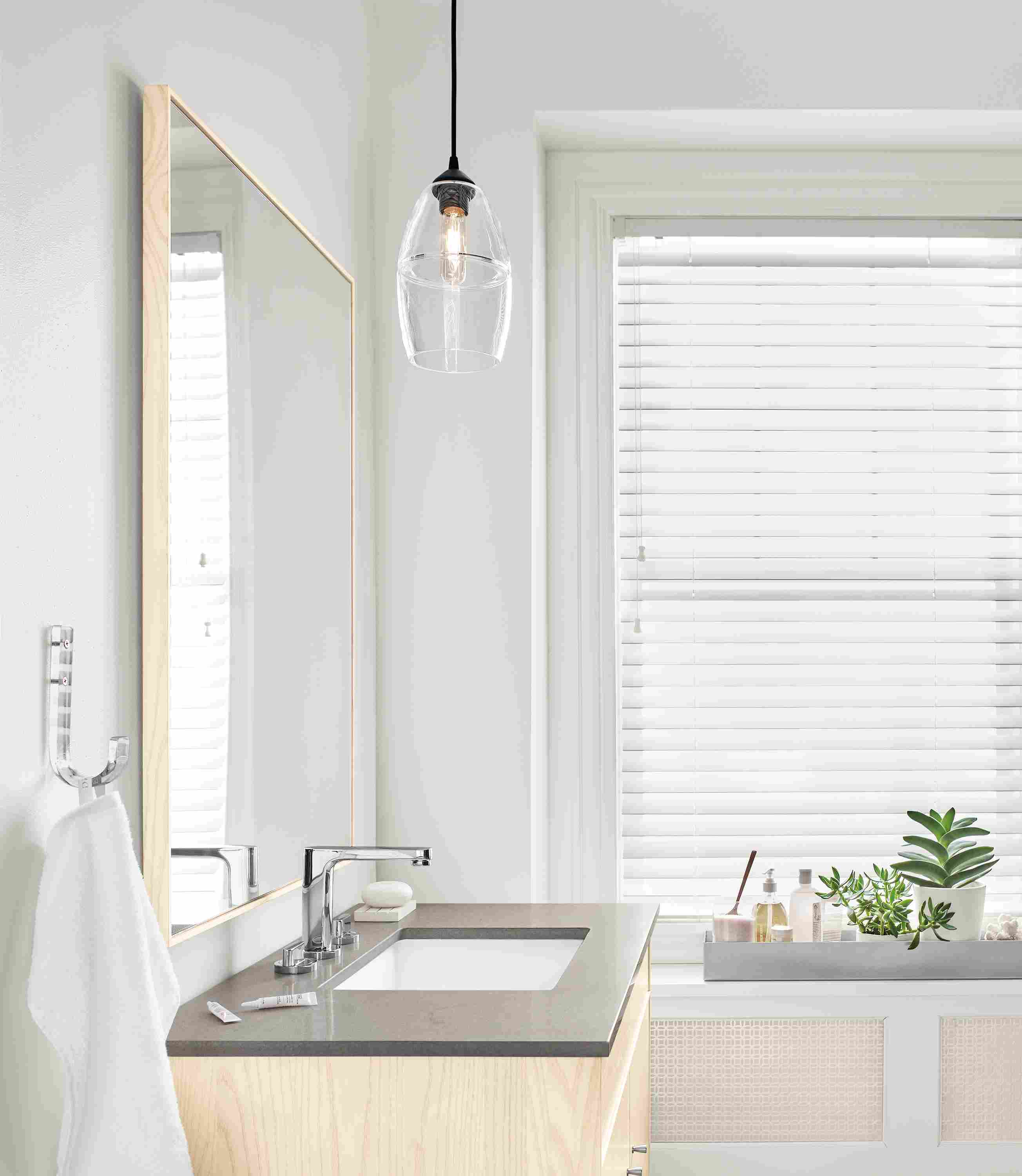 Side detail of Banded cone pendant in bathroom.