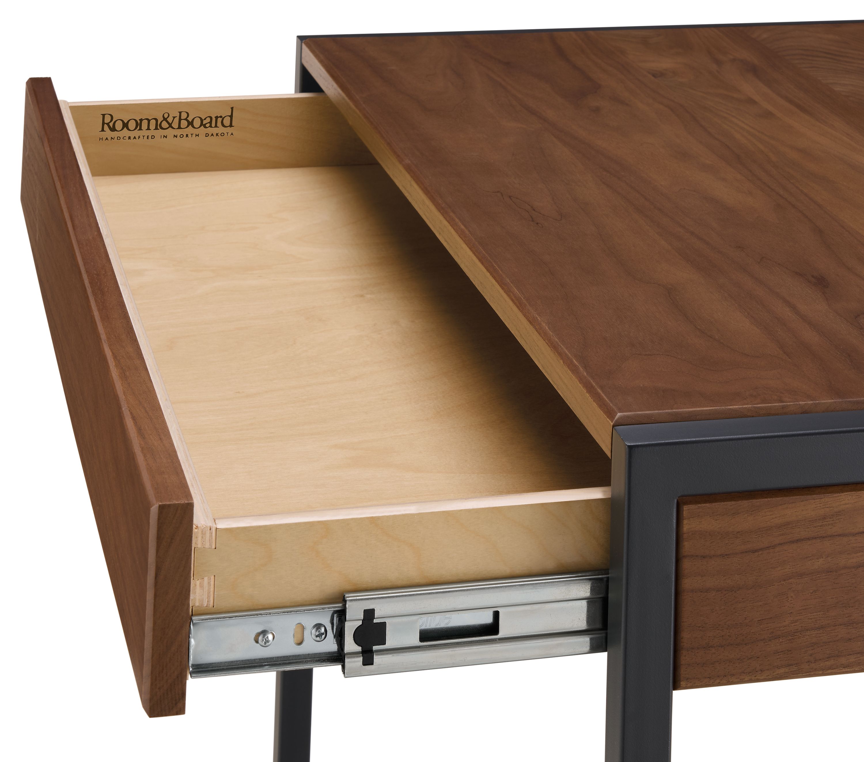 Detail of open drawer and slide mechanism on a basis 36-wide desk in walnut.