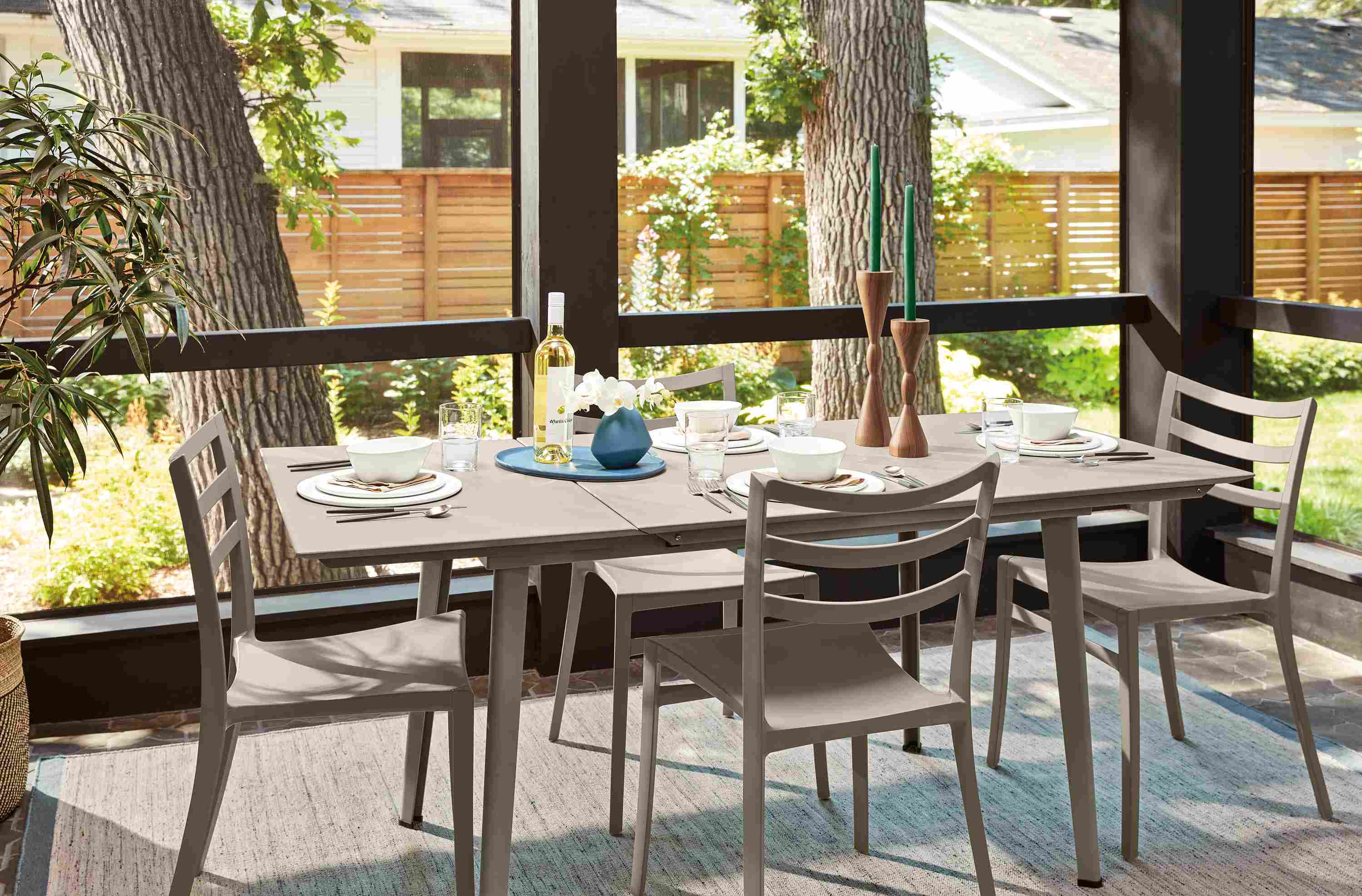 Sunroom with Bauer extension table in flint and 4 Sabrina chairs in taupe.