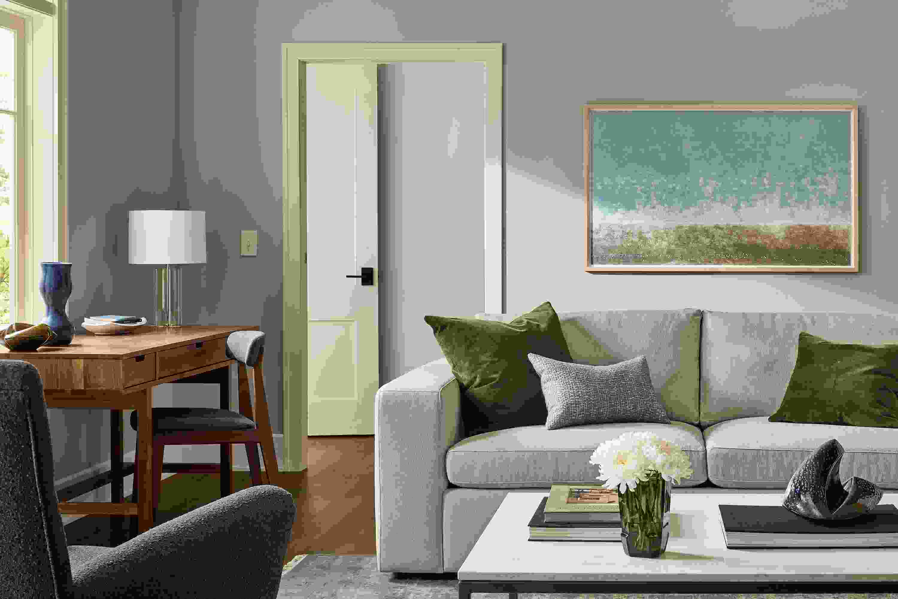 Living room with baylor 88-wide sofa in landen asphalt, boden chair in declan graphite and sivas rug in ocean.