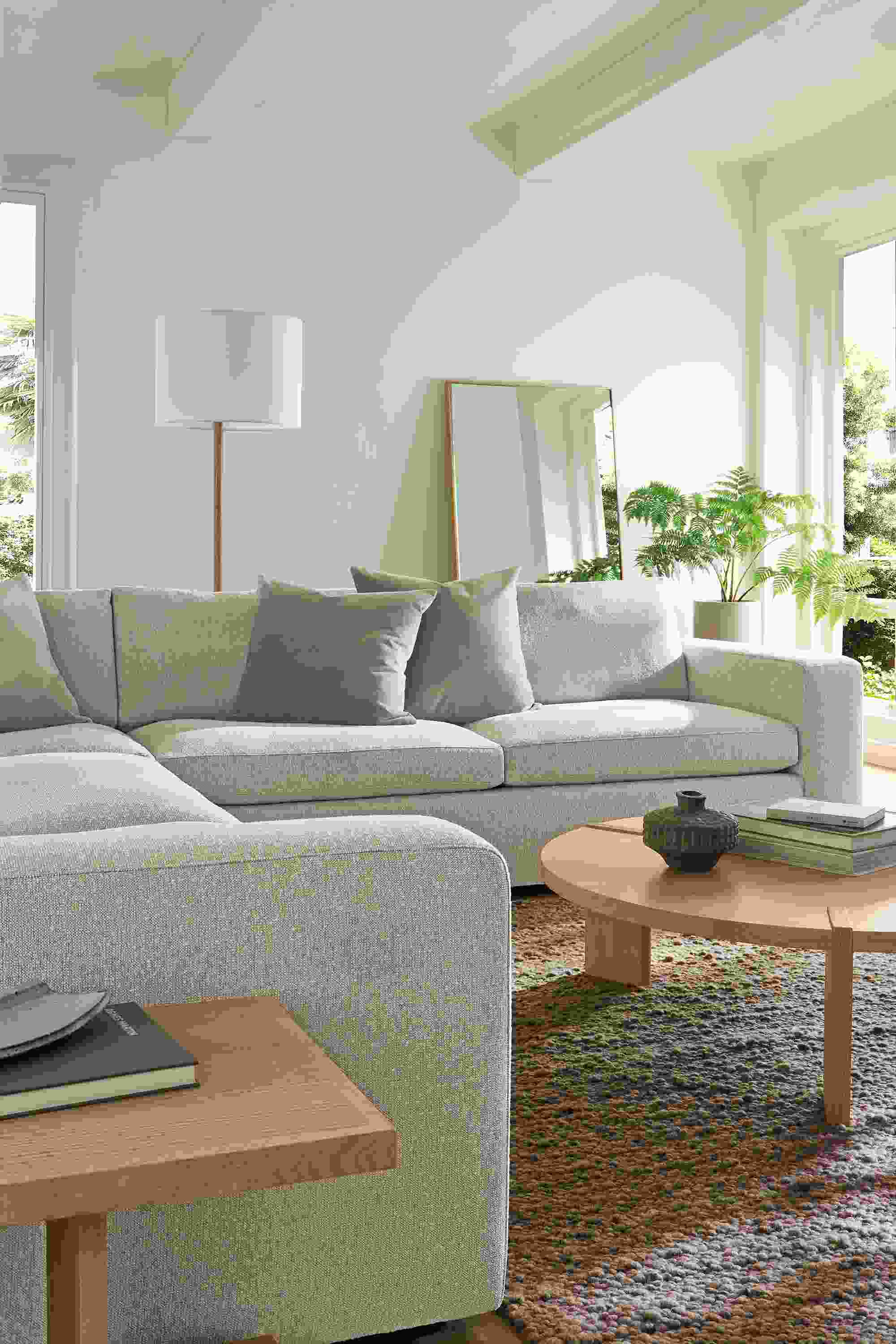 Living room with baylor 3-piece sectional in conley natural, graham end table and hanover coffee table in rye on red oak.
