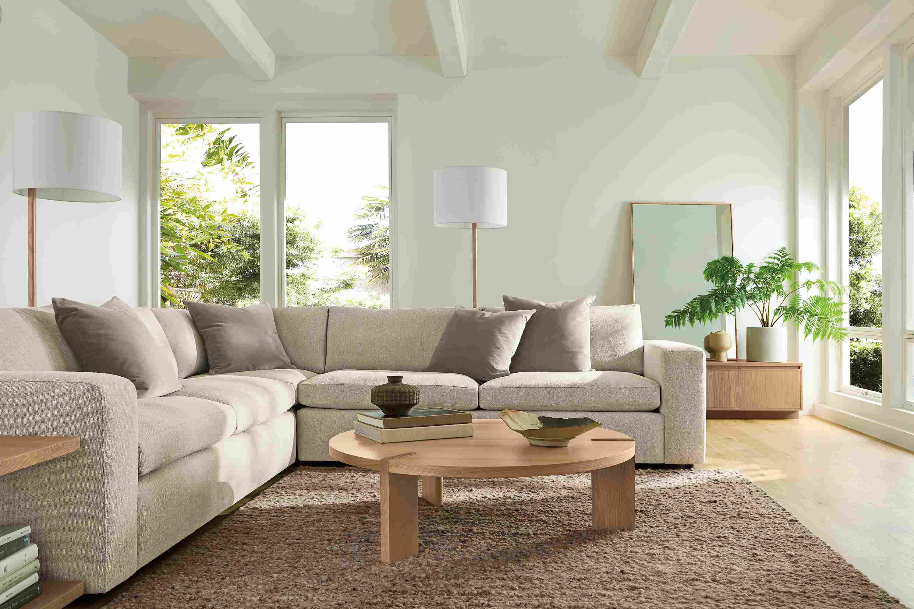Living room with baylor 3-piece sofa in conley natural, hanover coffee table and graham end table in rye on red oak.