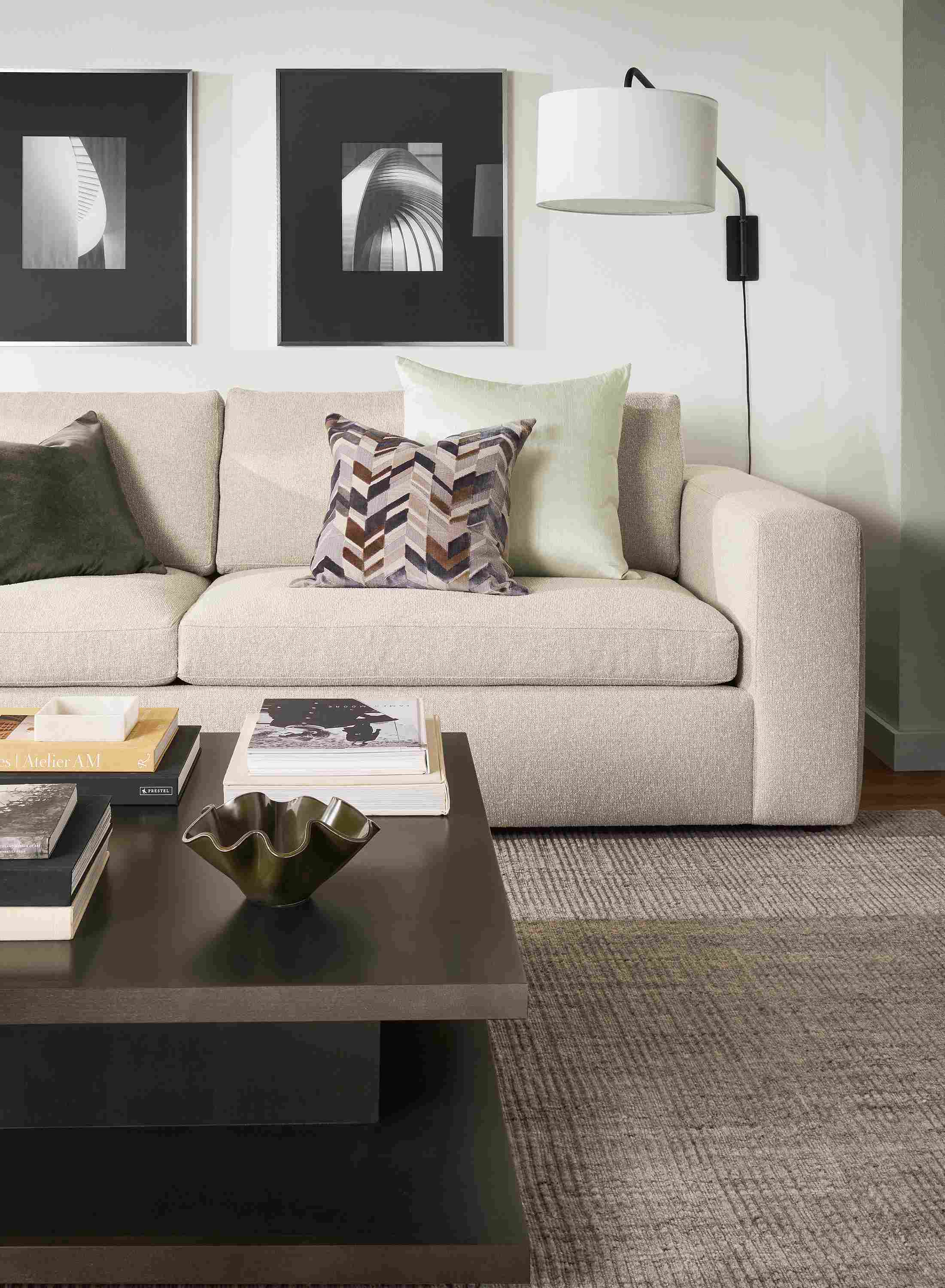 Living room with baylor sofa in conley natural and graham 42 by 42 coffee table in charcoal.