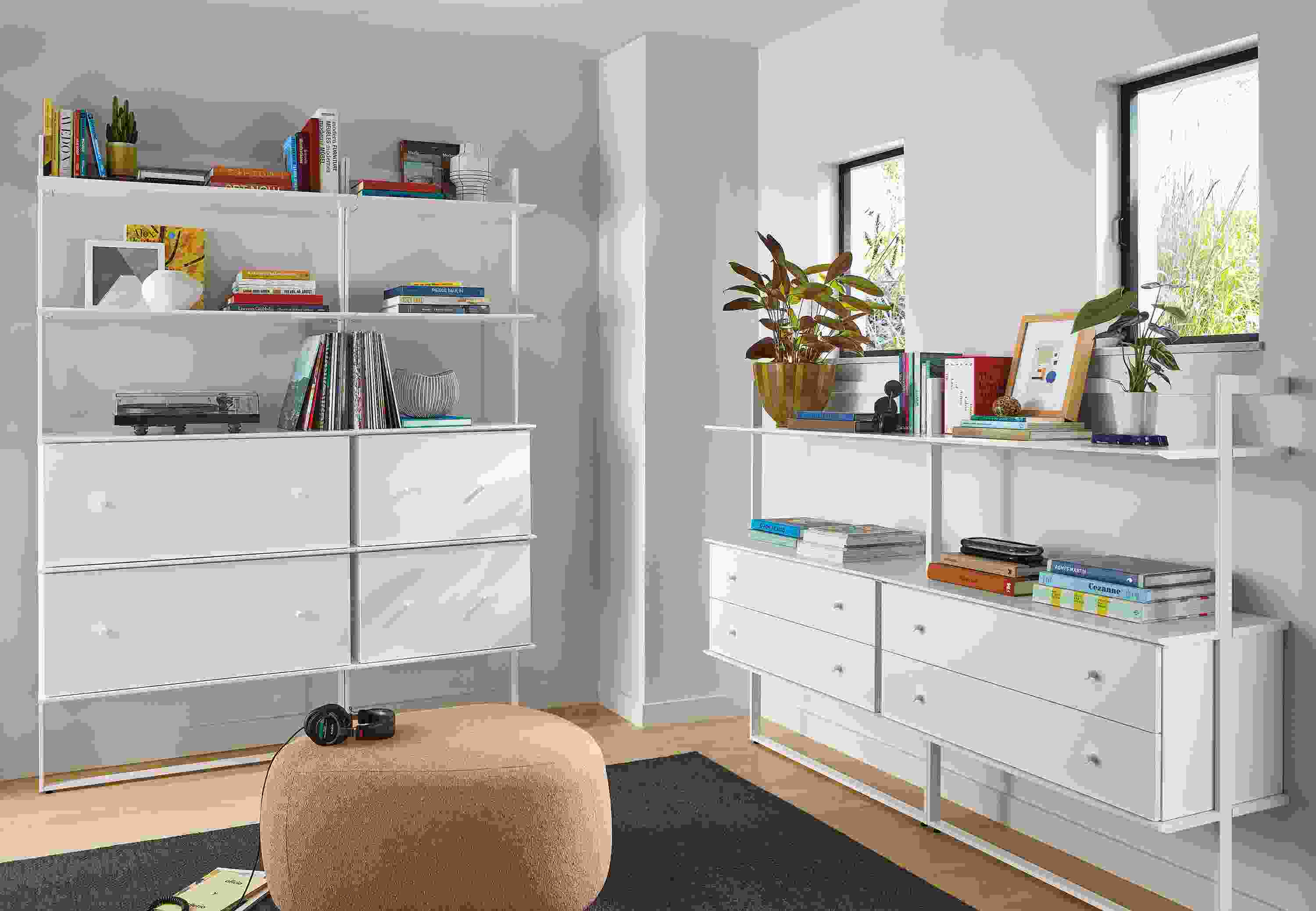 room with beam bookcases in white with white shelving and inserts and asher otttoman in declan sienna fabric.
