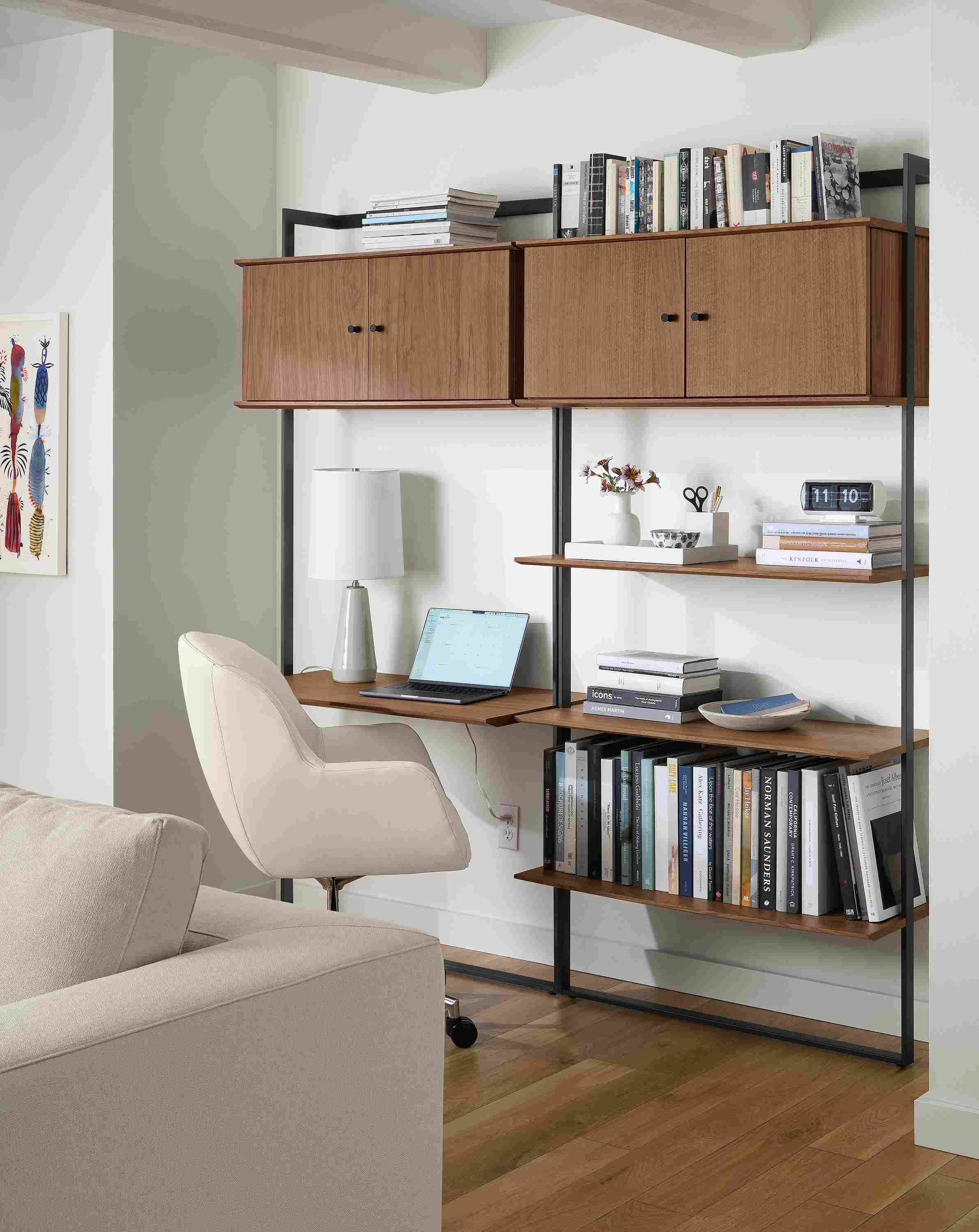 Office area with Beam 36-wide desk with 16-deep shelves in graphite with walnut and nico office chair in tatum bone.