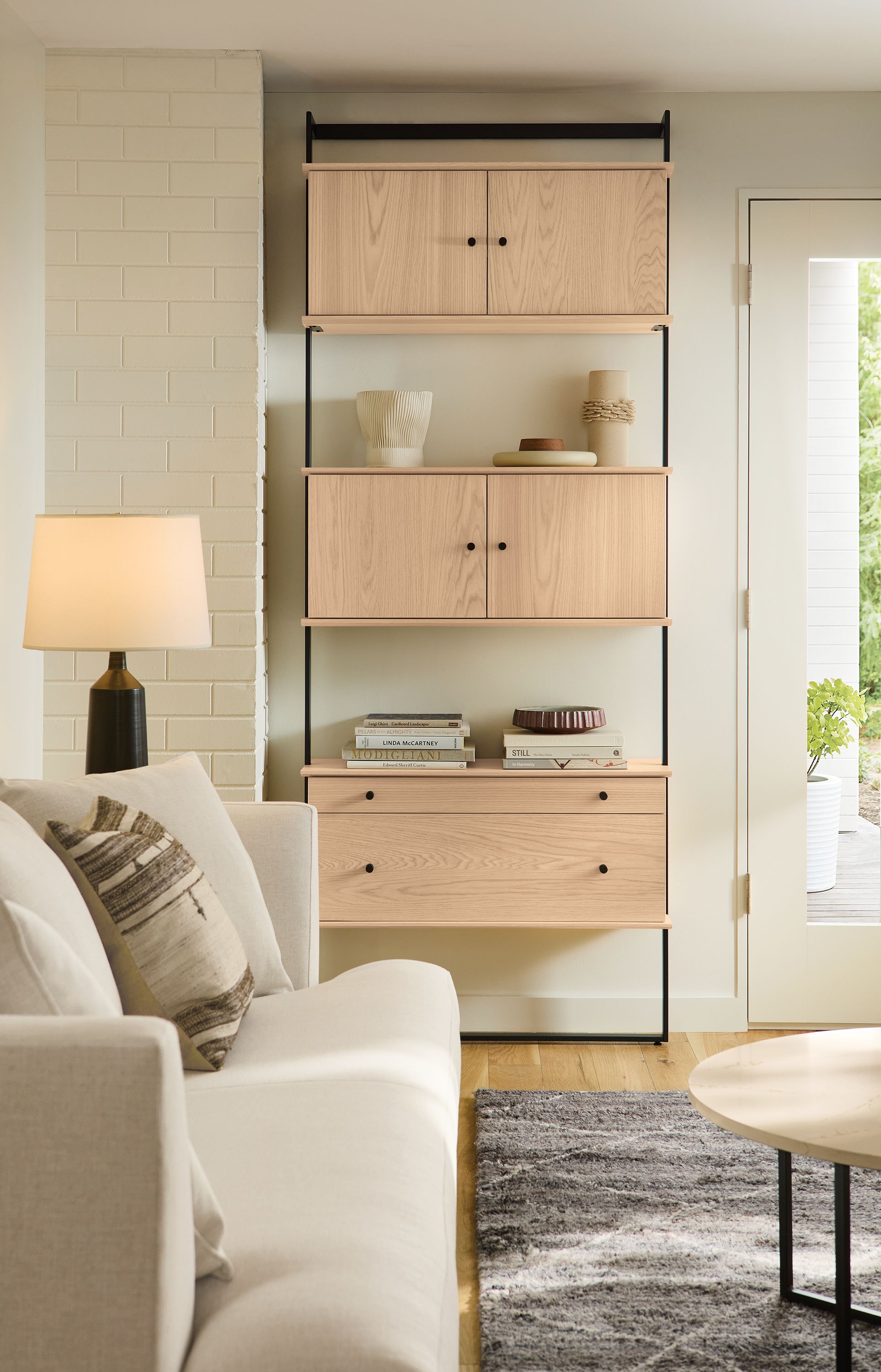Living room with Beam 6-wide bookcase in graphite with beam multiple Beam inserts in salt on red oak.