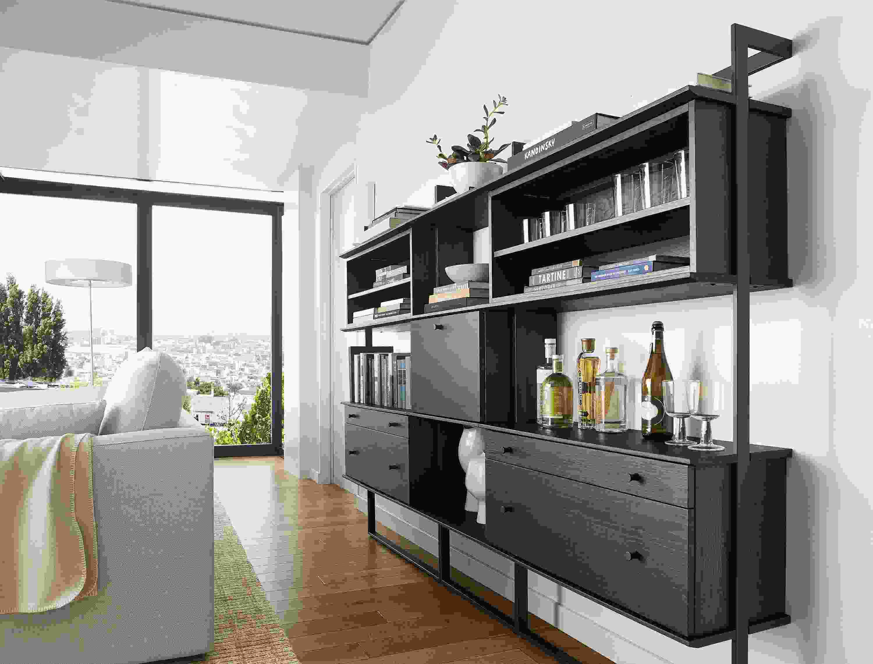 living room with beam bookcase wall unit in charcoal stained ash and graphite steel.
