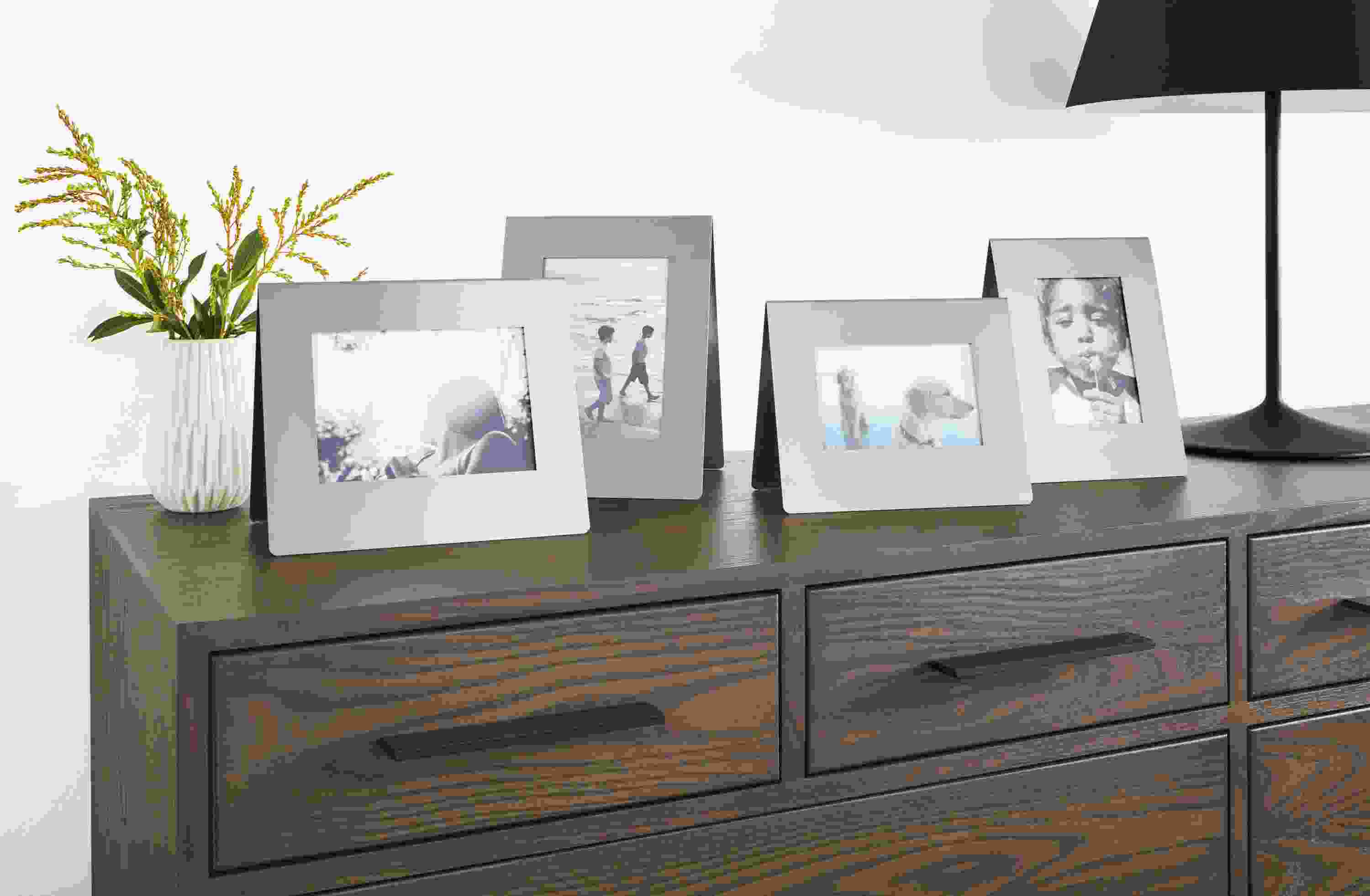 Detail of Bend picture frames in stainless steel.