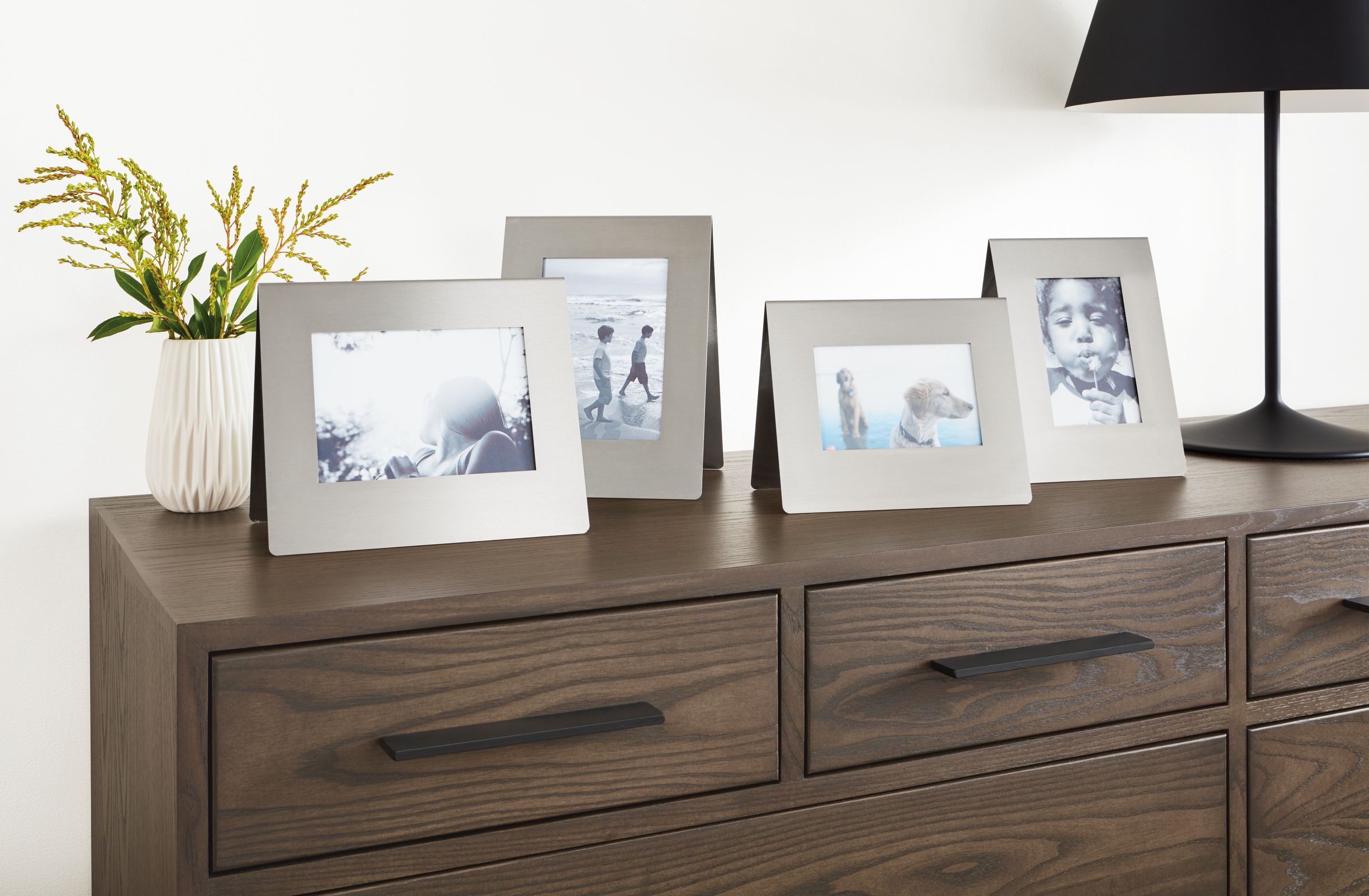 Detail of Bend picture frames in stainless steel.