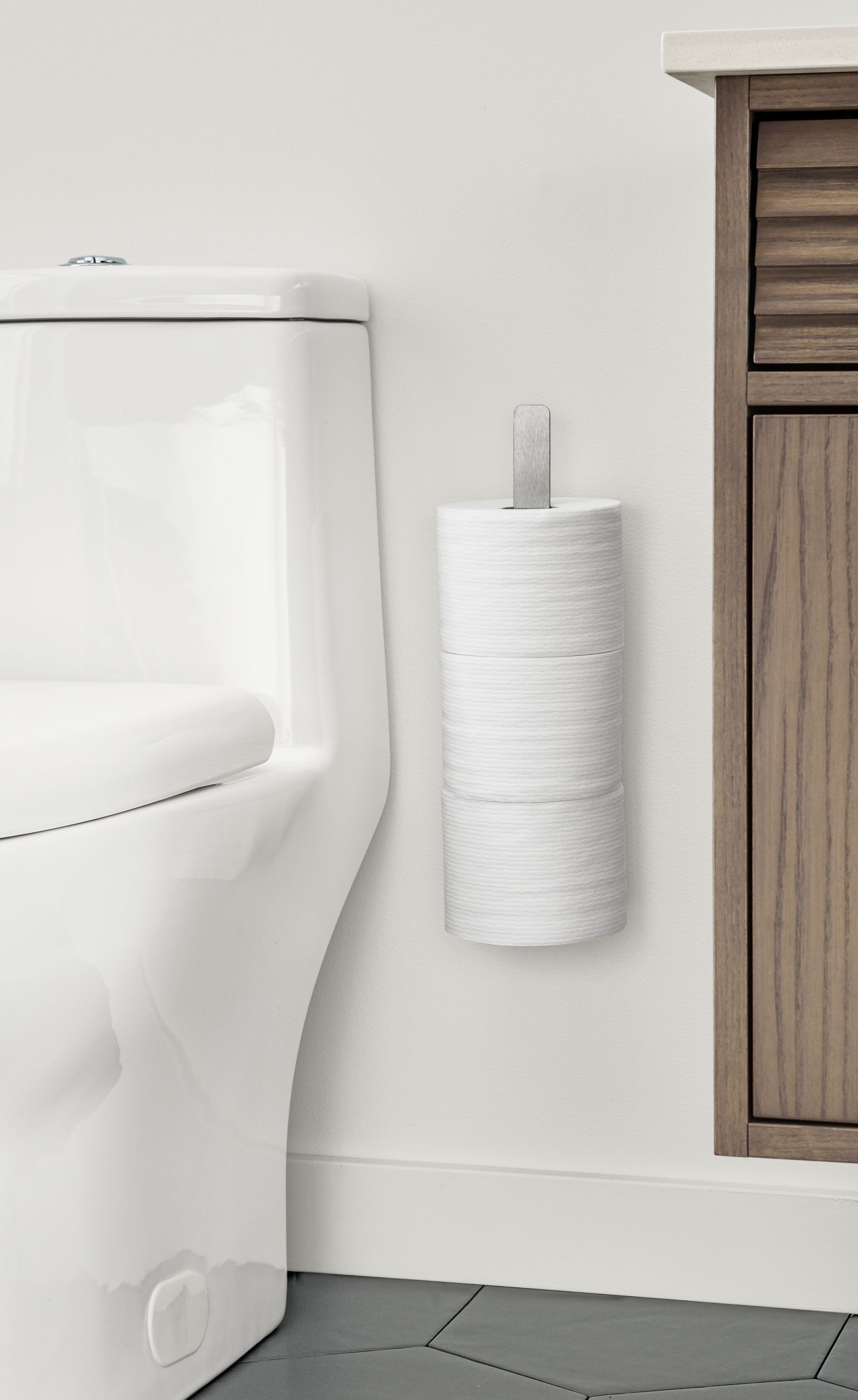Detail of Bend wall mounted toilet paper holder.