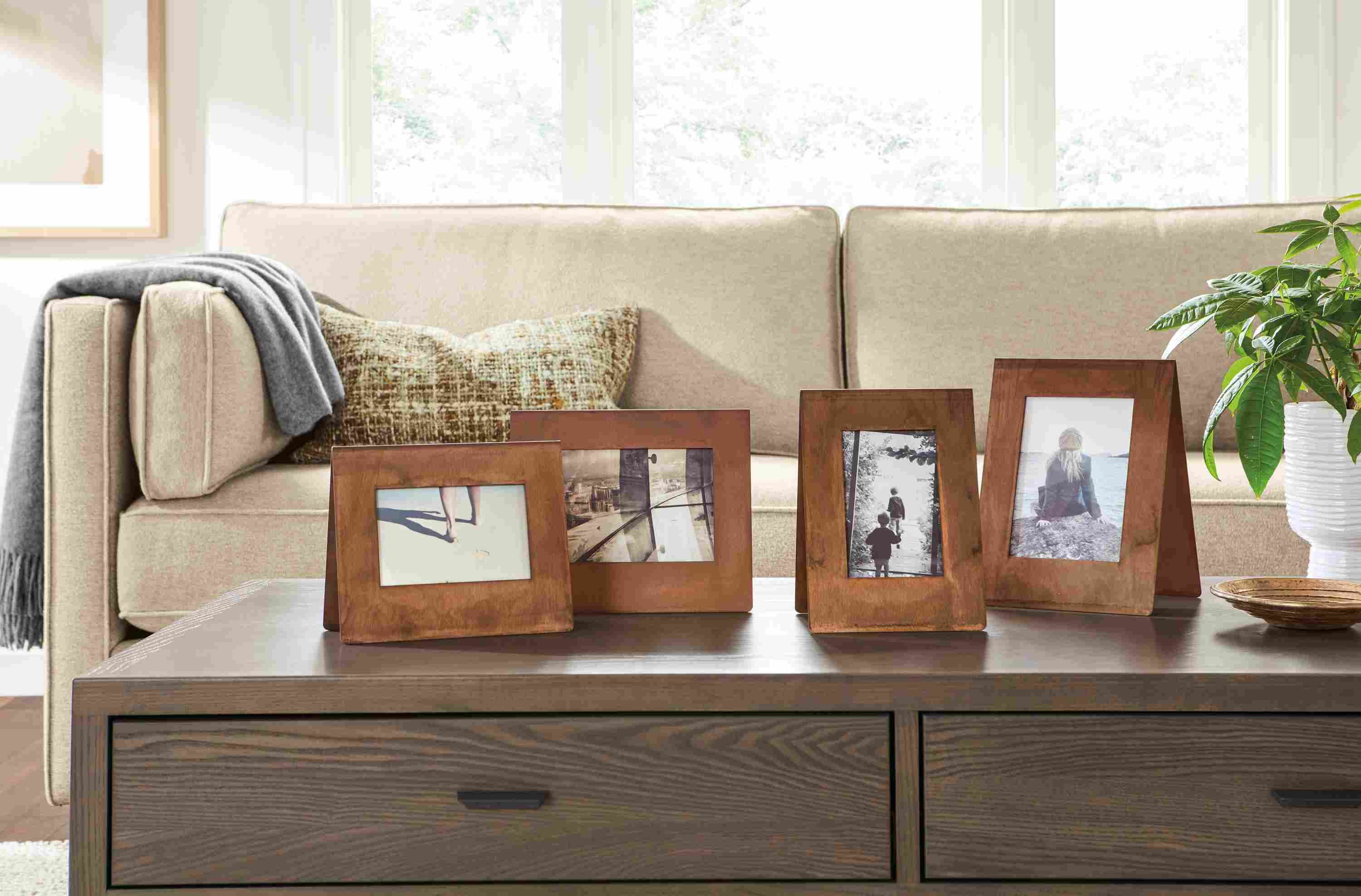 Detail of Bend picture frames in patina.