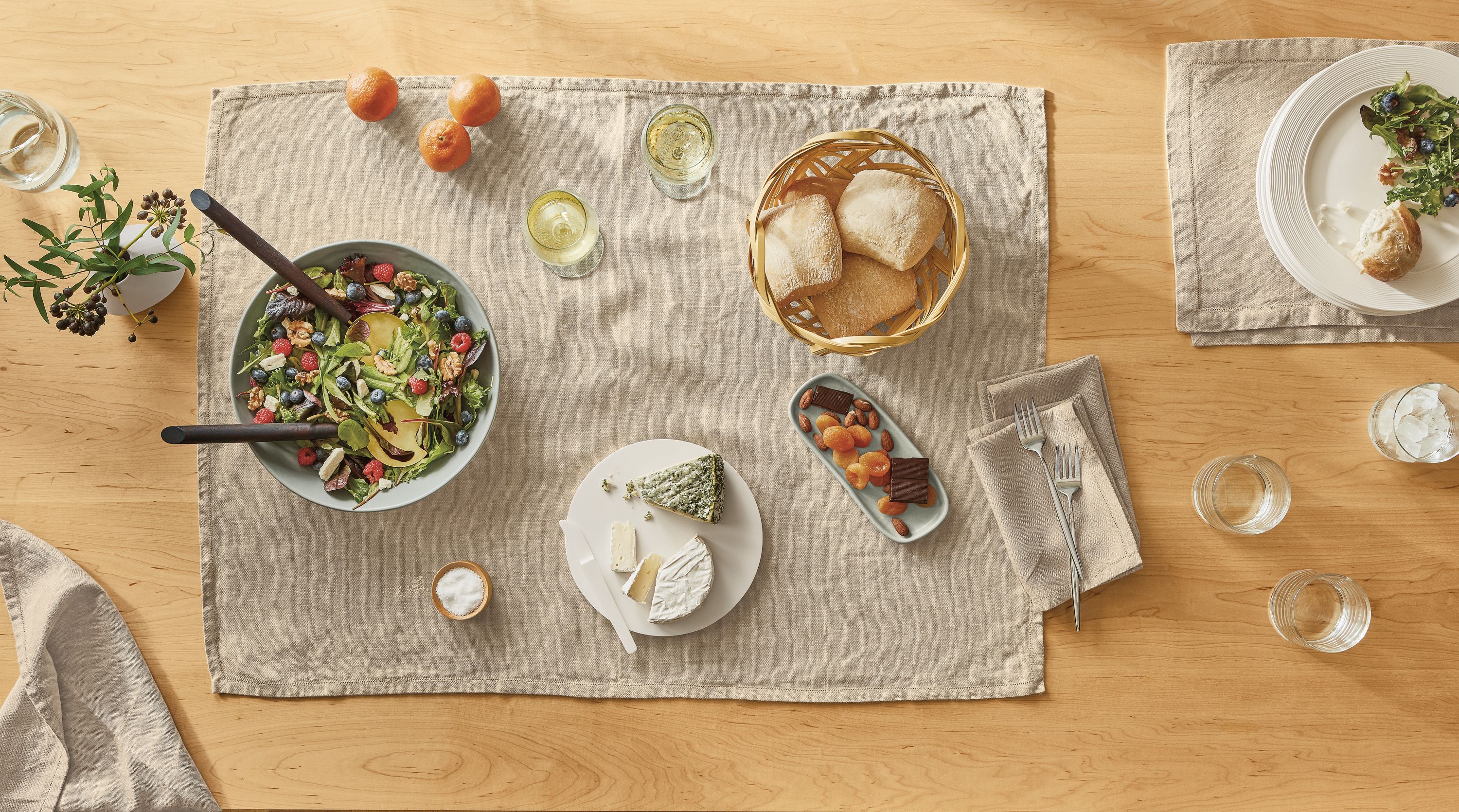 Detail of table top with Bene linens, Nadia tray, Mendota serving board, Anya bowl.