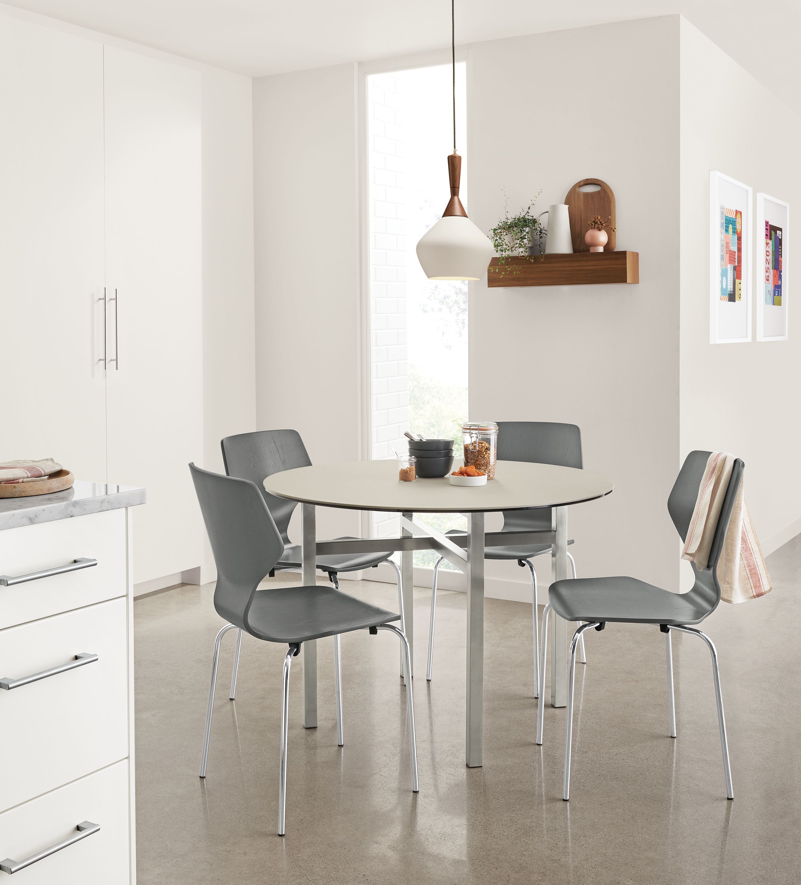 Kitchen area with Pike chairs in grey and Cloak pendant light in white.