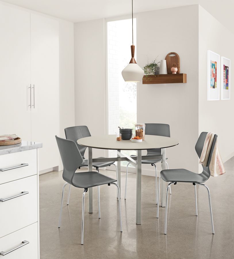 Kitchen area with Pike chairs in grey and Cloak pendant light in white.