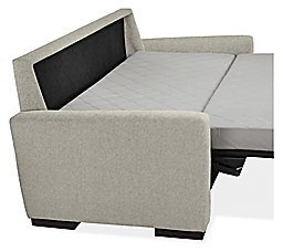 Angled side view of Berin sleeper sofa mattress in open position.