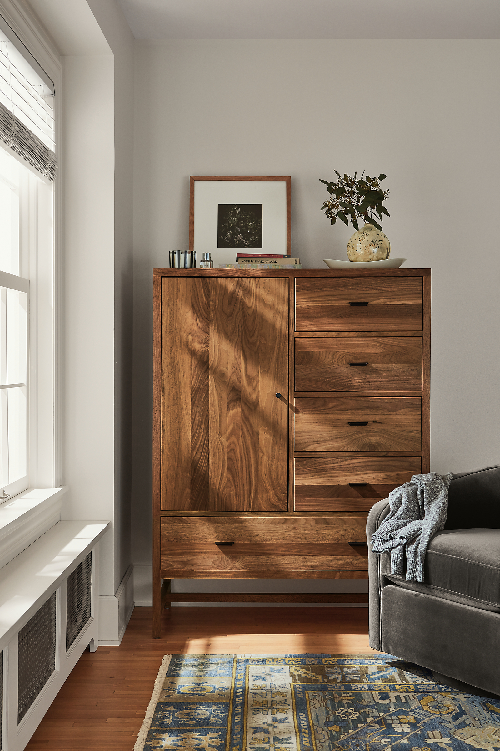 detail of berkeley storage cabinet in walnut in bedroom.