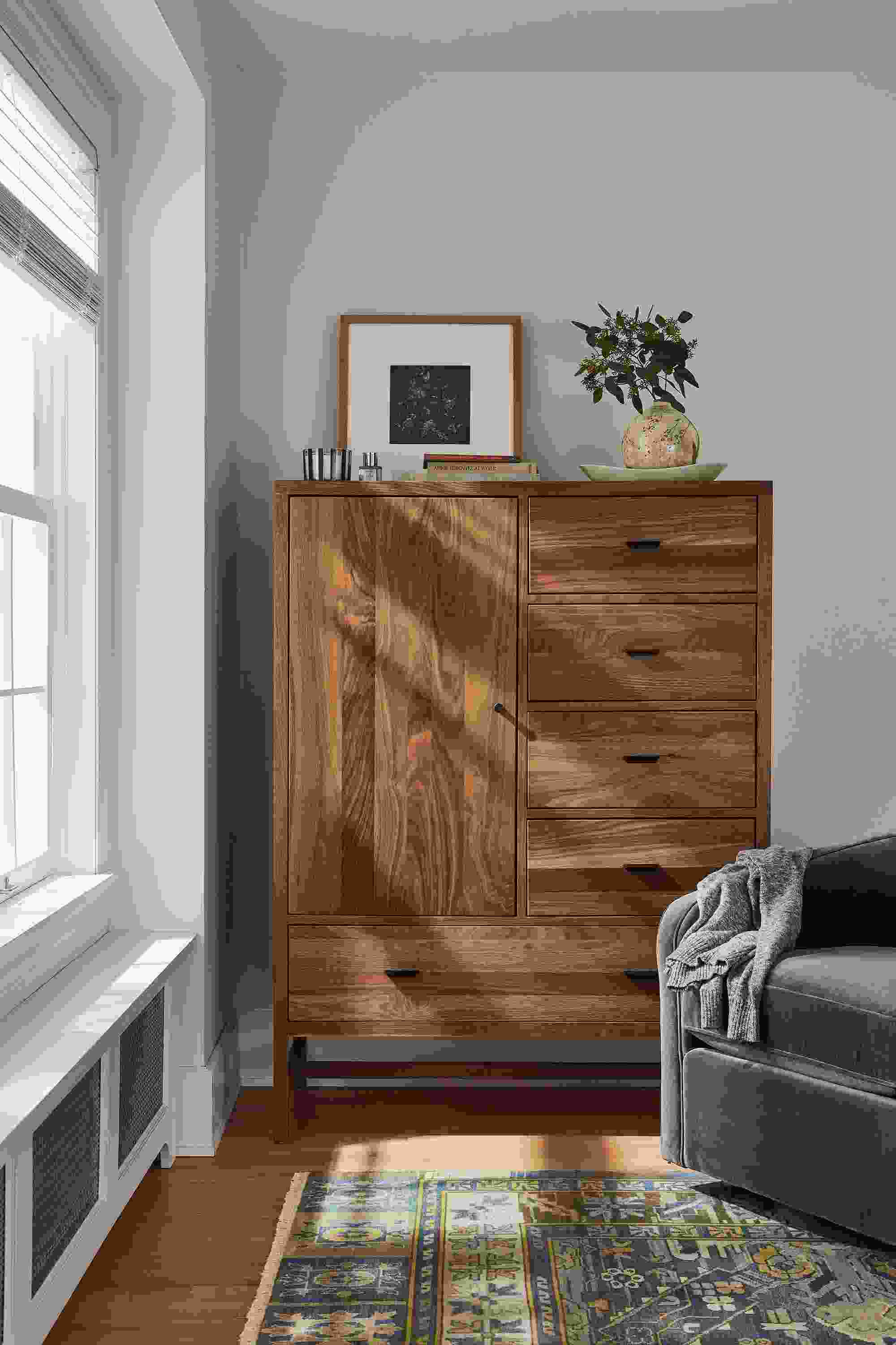 detail of berkeley storage cabinet in walnut in bedroom.