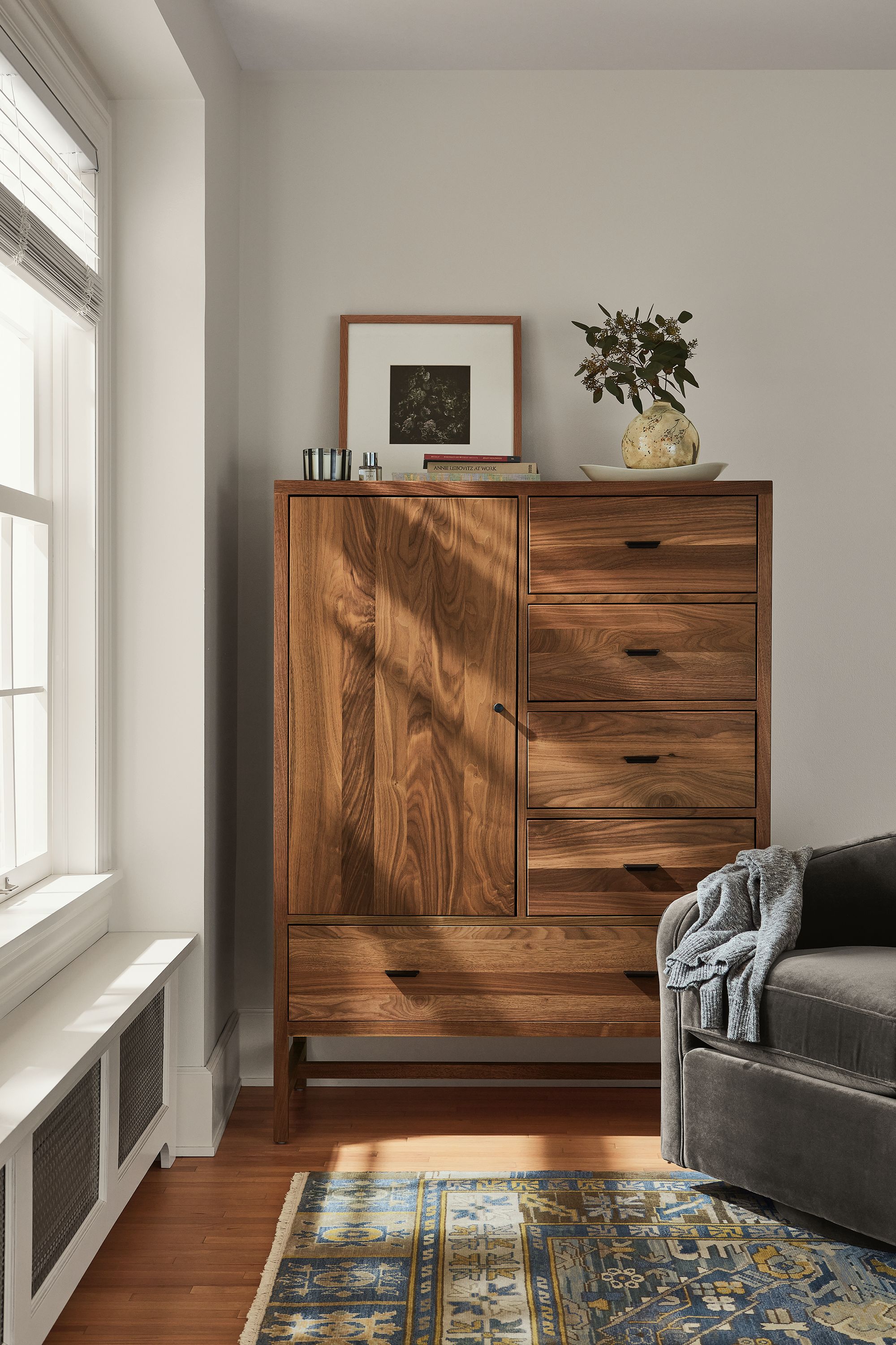 detail of berkeley storage cabinet in walnut in bedroom.