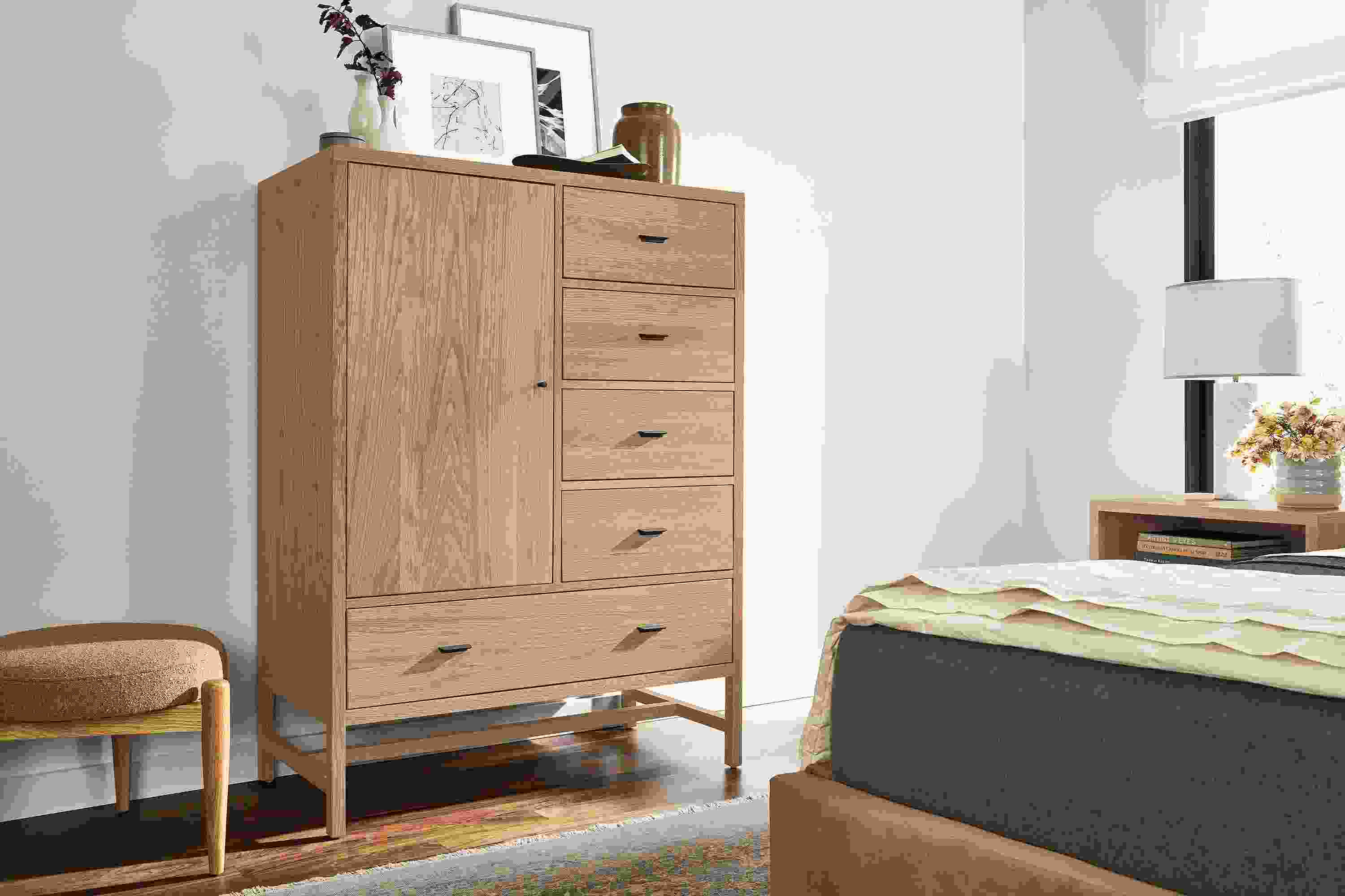 Bedroom with berkeley 42-wide storage cabinet and berkeley nightstand in rye on red oak and marlo storage bed in banks camel.