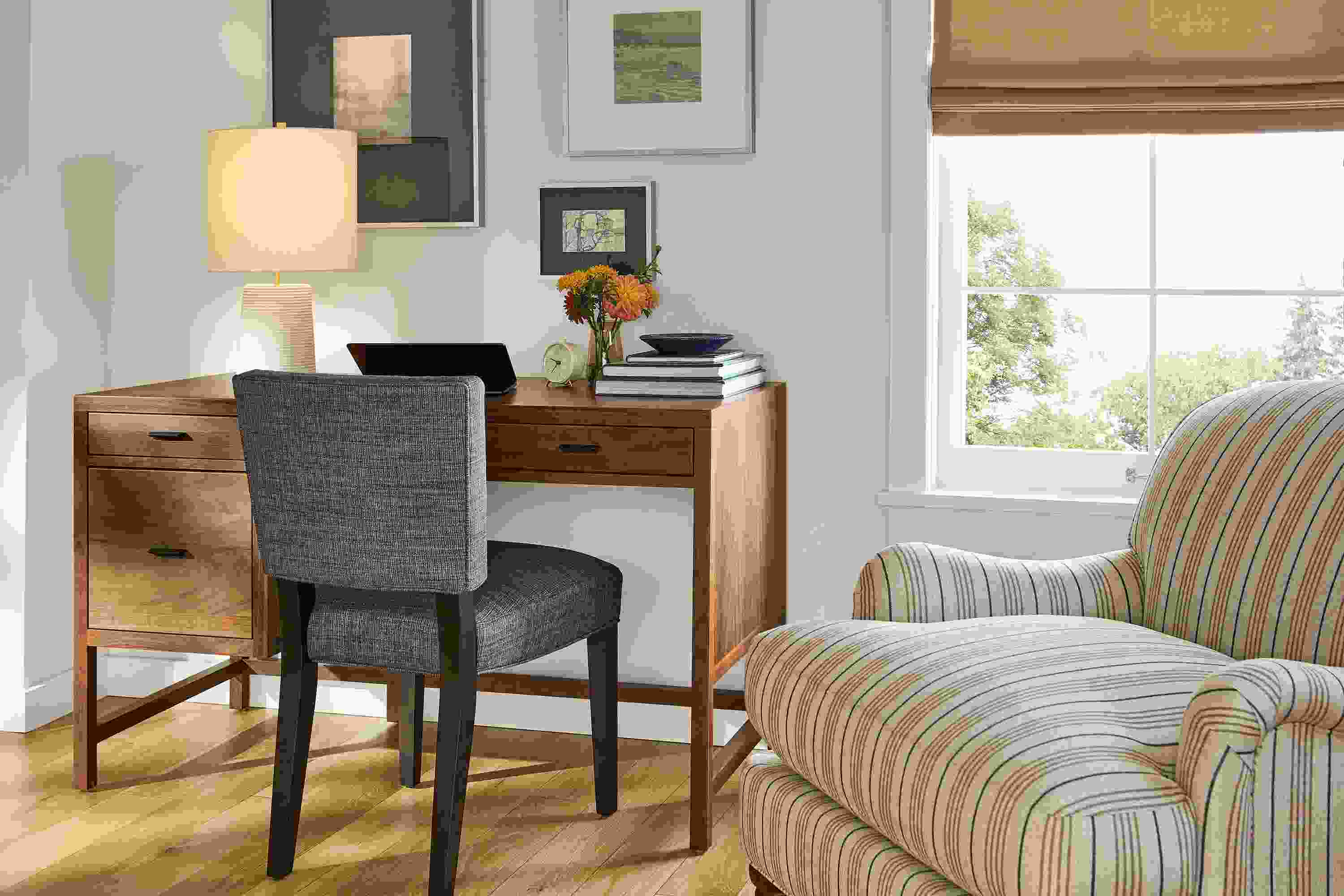 Living room with Berkeley 50-wide desk with file drawer in walnut and Georgia side chair in Alston Ink with charcoal legs.