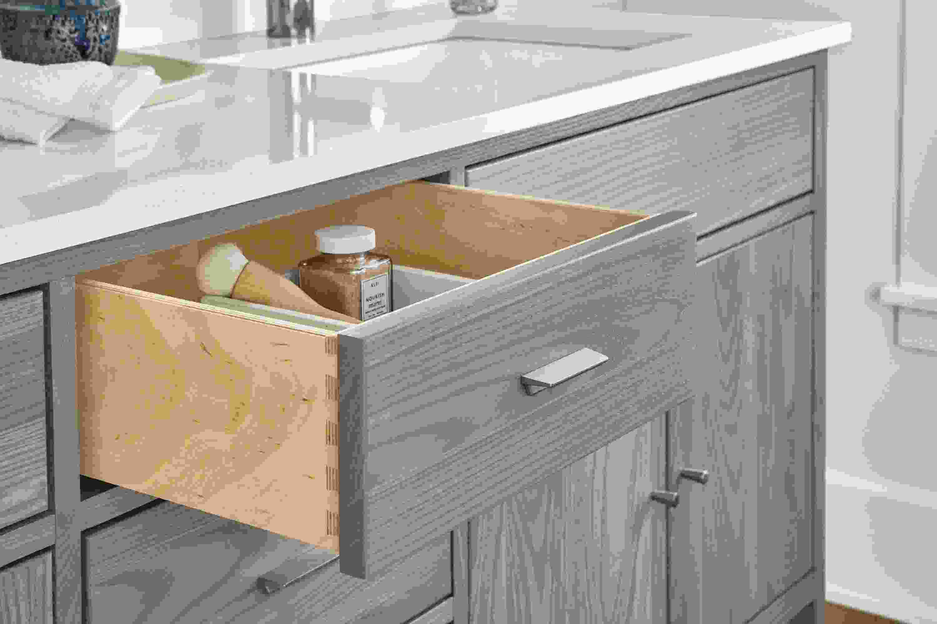 Close detail of Berkeley vanity with open drawer.