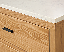 Close up detail of Berkeley storage cabinet in White Oak with Marbled White Quartz Top.