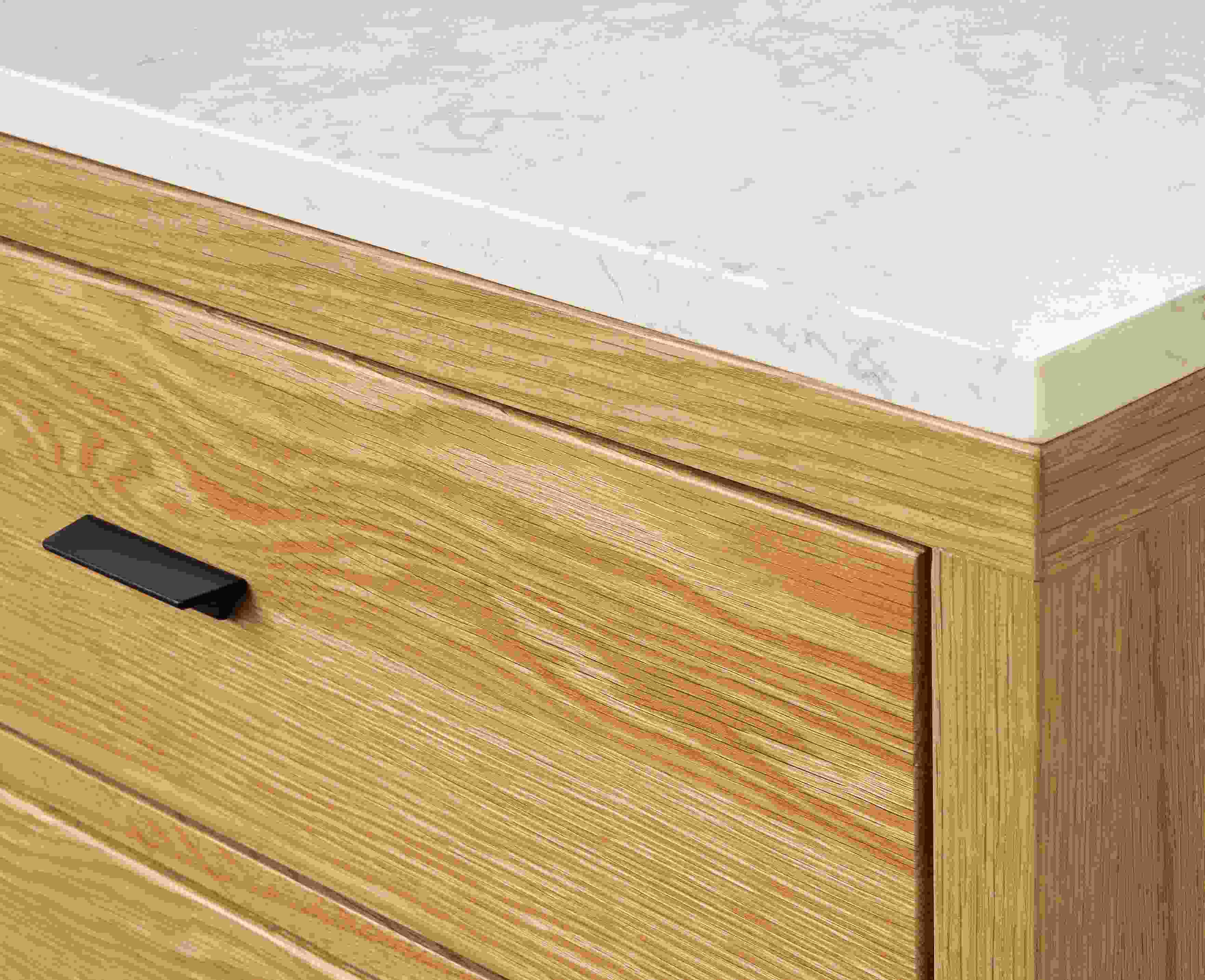 Close up detail of Berkeley storage cabinet in White Oak with Marbled White Quartz Top.