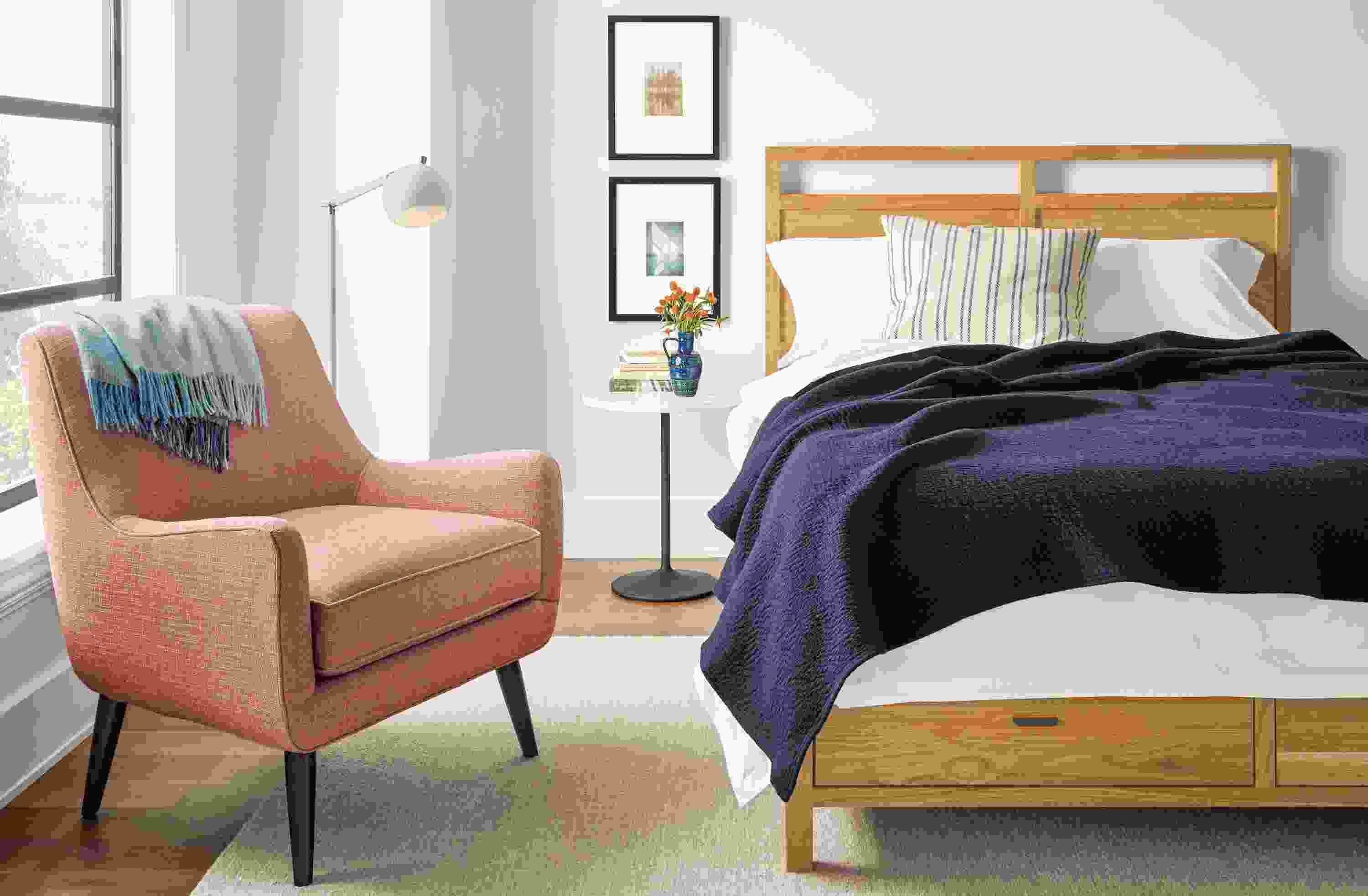 Detail of Berkeley queen storage bed in white oak in bedroom.