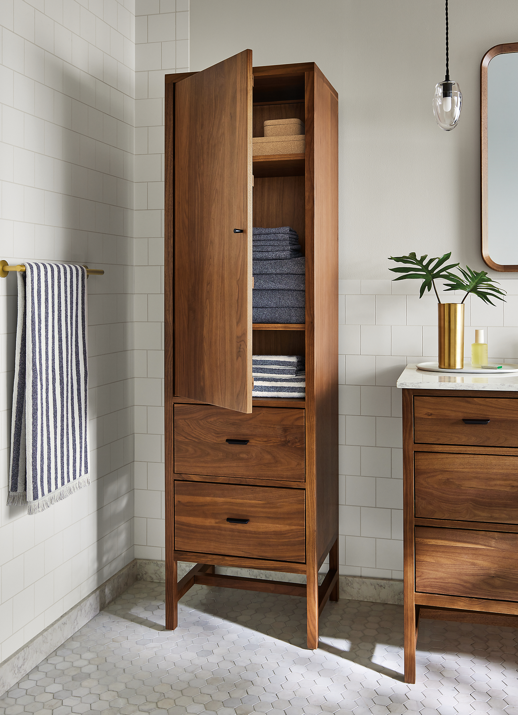 Bathroom with Berkeley 20-wide linen cabinet with door and Berkeley 60-wide vanity with marbled white quartz top.