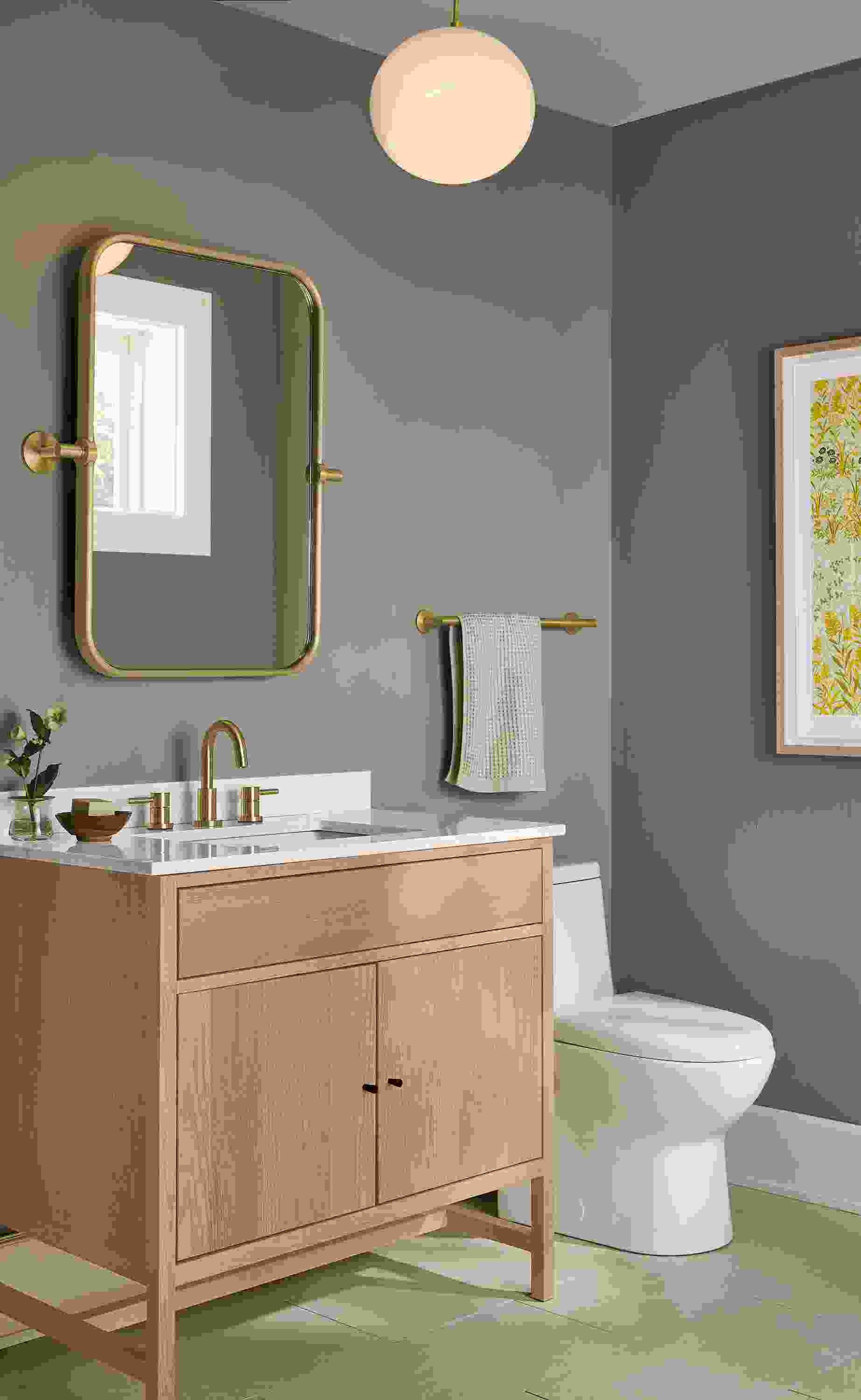 Bathroom with berkeley 36-wide single sink vanity in rye on red oak and lyndale mirror in brushed gold.