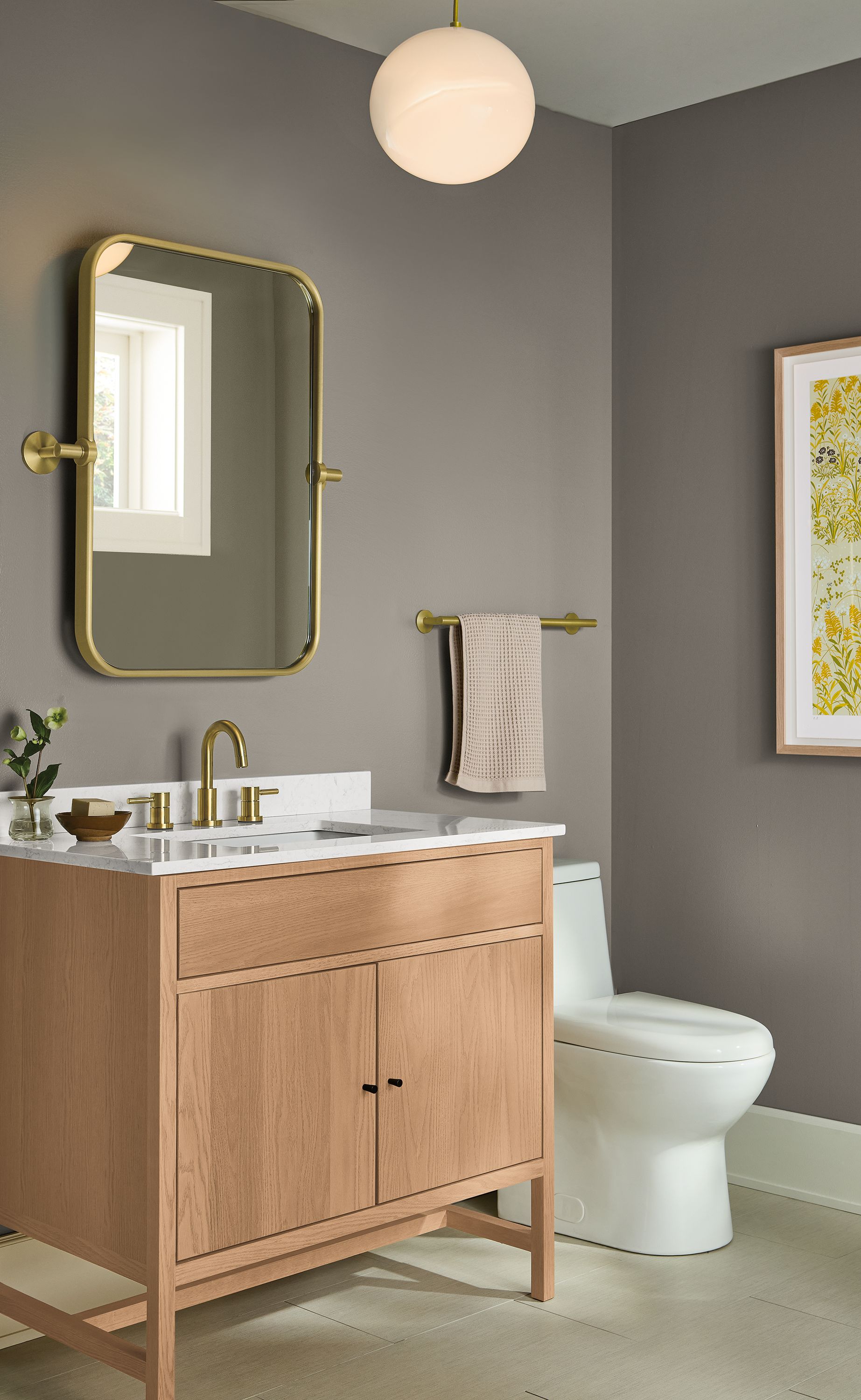 Bathroom with berkeley 36-wide single sink vanity in rye on red oak and lyndale mirror in brushed gold.