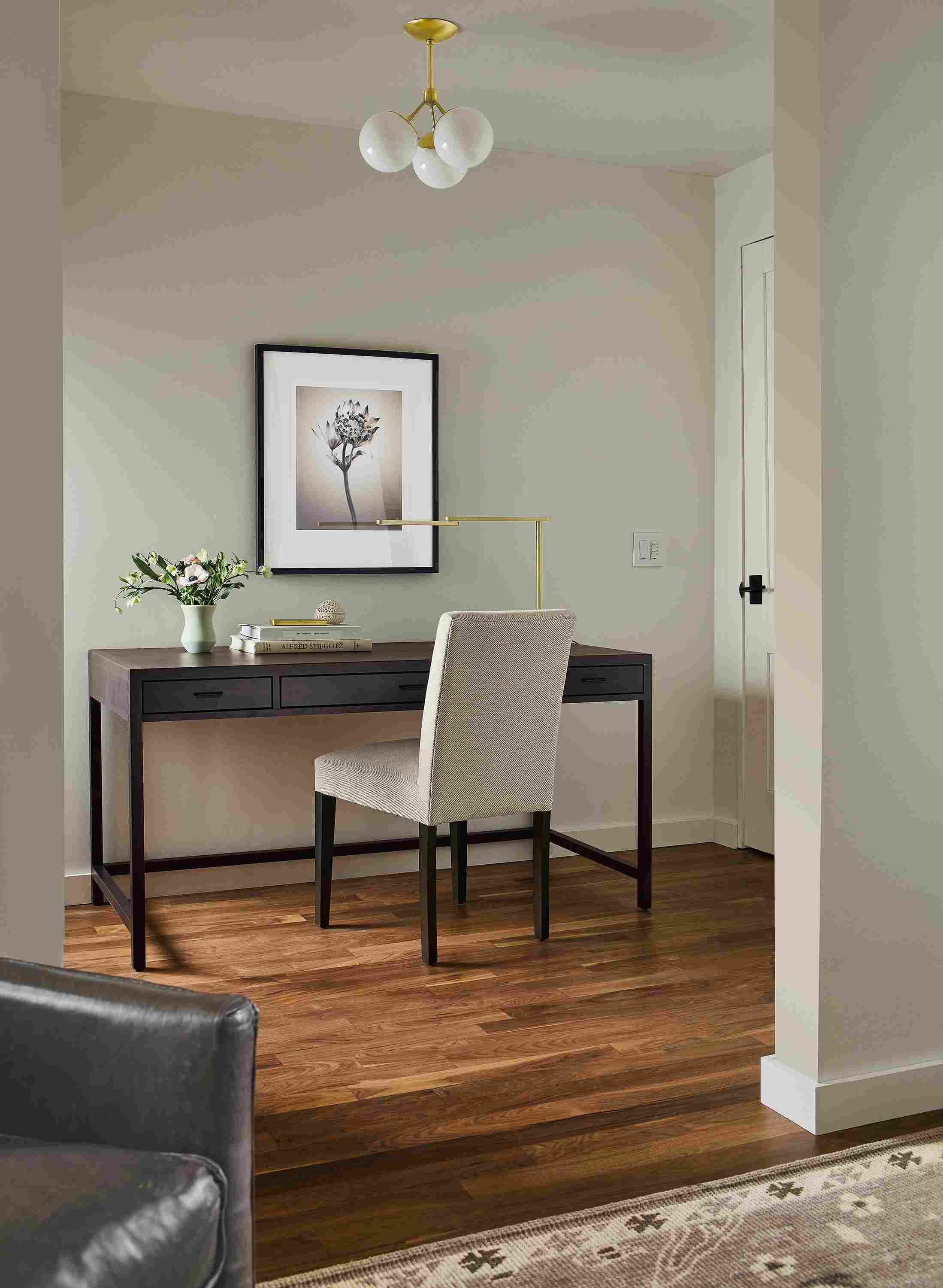 Home office with berkeley 60-wide desk in charcoal and peyton side chair in derry natural fabric.