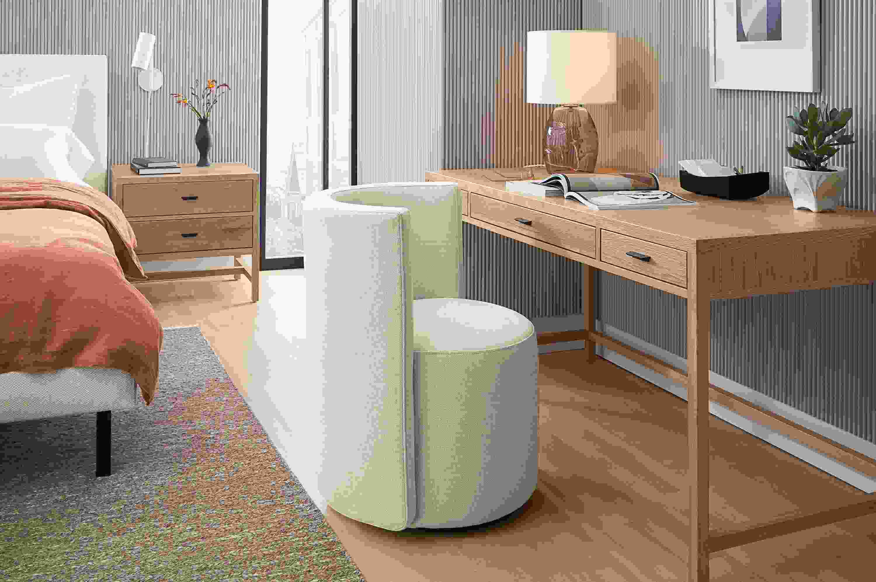 Bedroom with berkeley 60-wide desk in rye on red oak and como dining chair in sumner ivory.