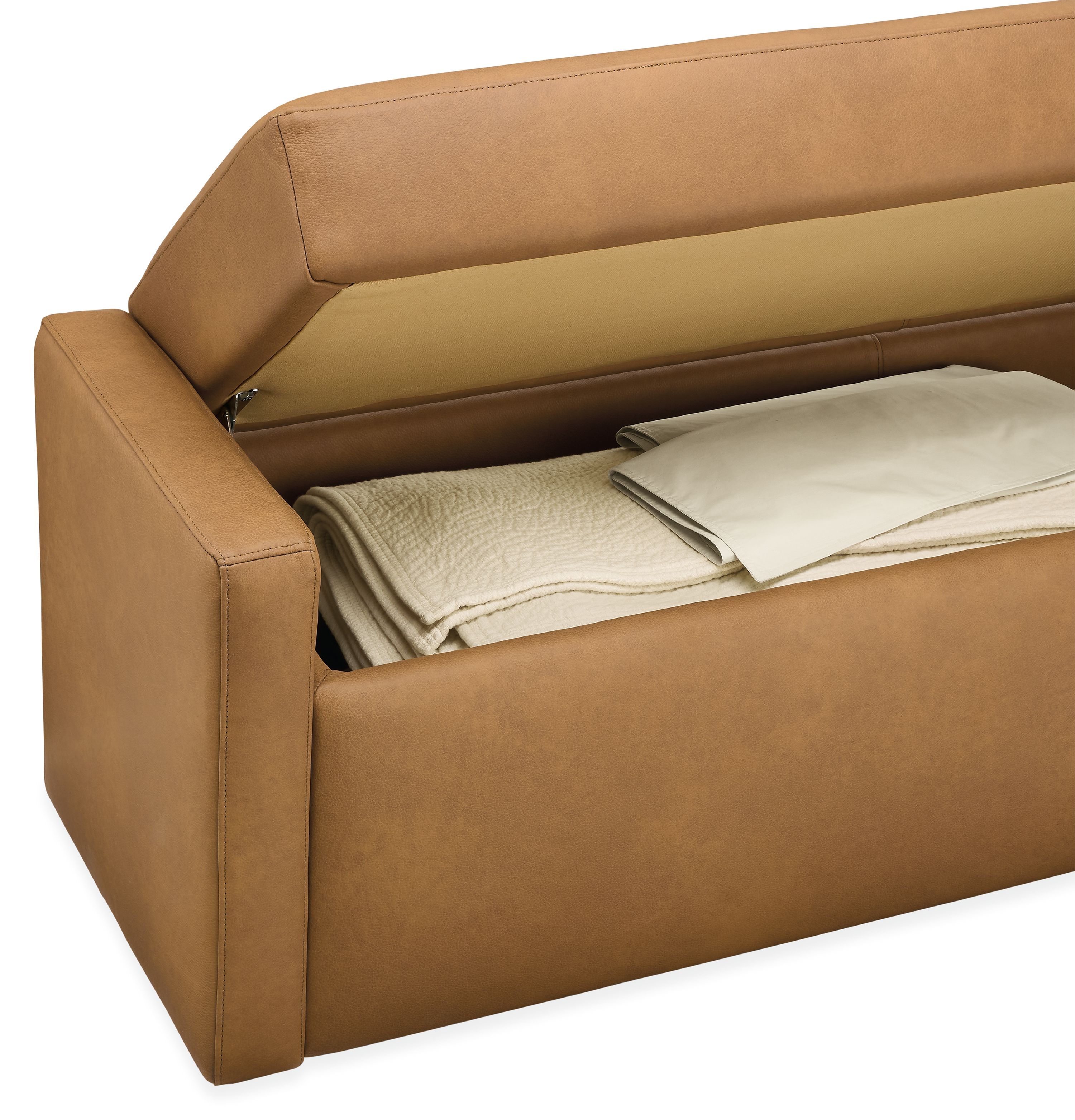 Blakely 60-wide storage bench in laino camel leather shown open with thea coverlet in natural inside.