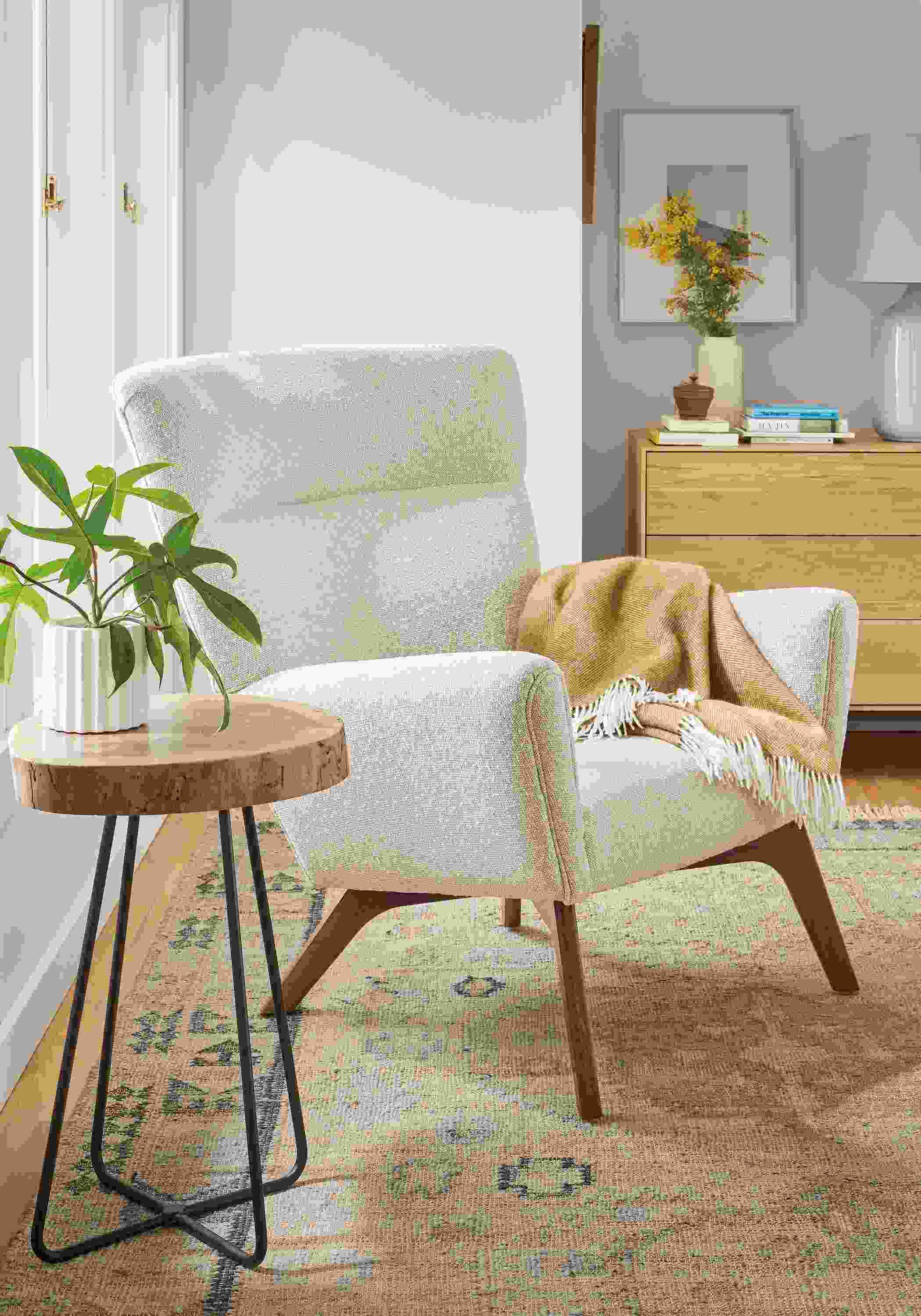 living room with boden chair in conley fabric, wellington end table in walnut, villa rug.