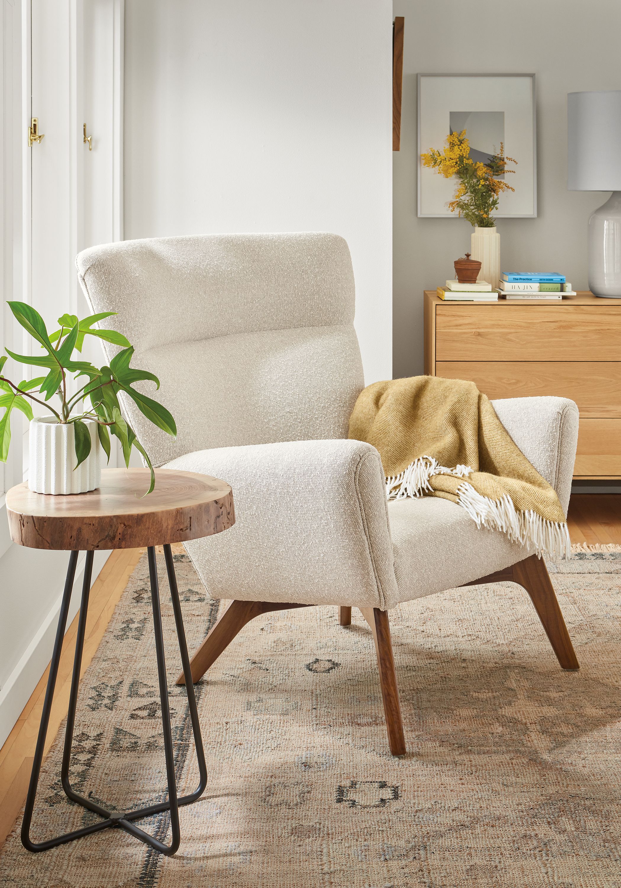 living room with boden chair in conley fabric, wellington end table in walnut, villa rug.