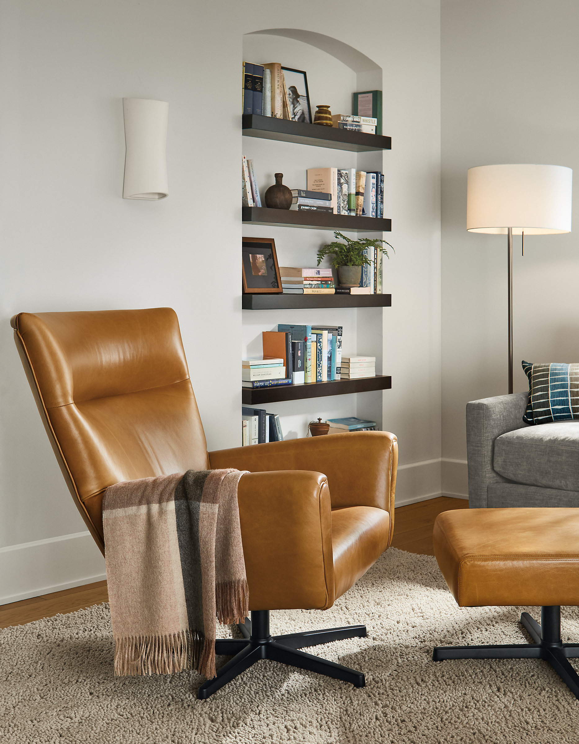 living room with Boden Swivel Chair and ottoman in Vento Leather.