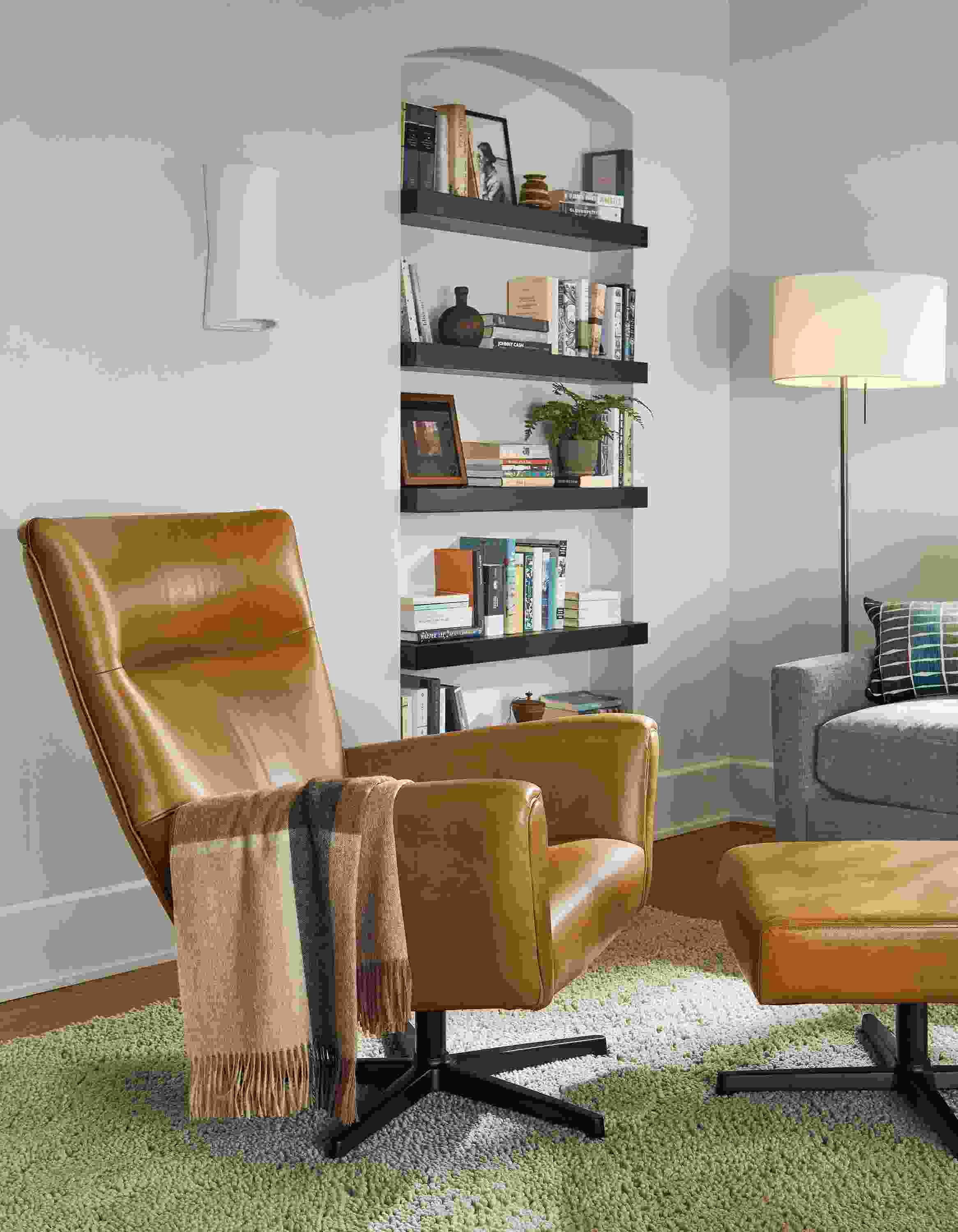 living room with Boden Swivel Chair and ottoman in Vento Leather.