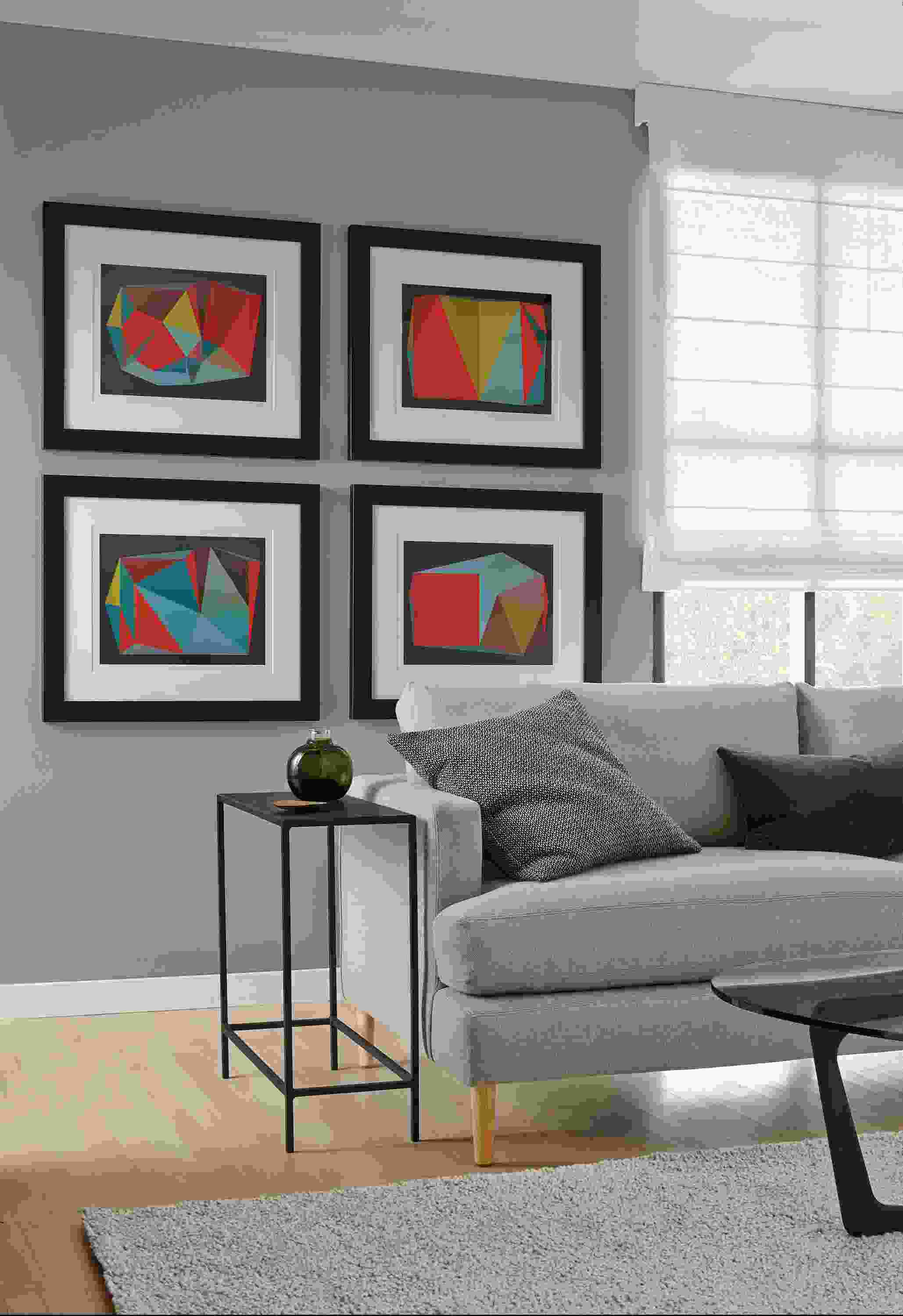 Detail of four framed Bossiere prints.