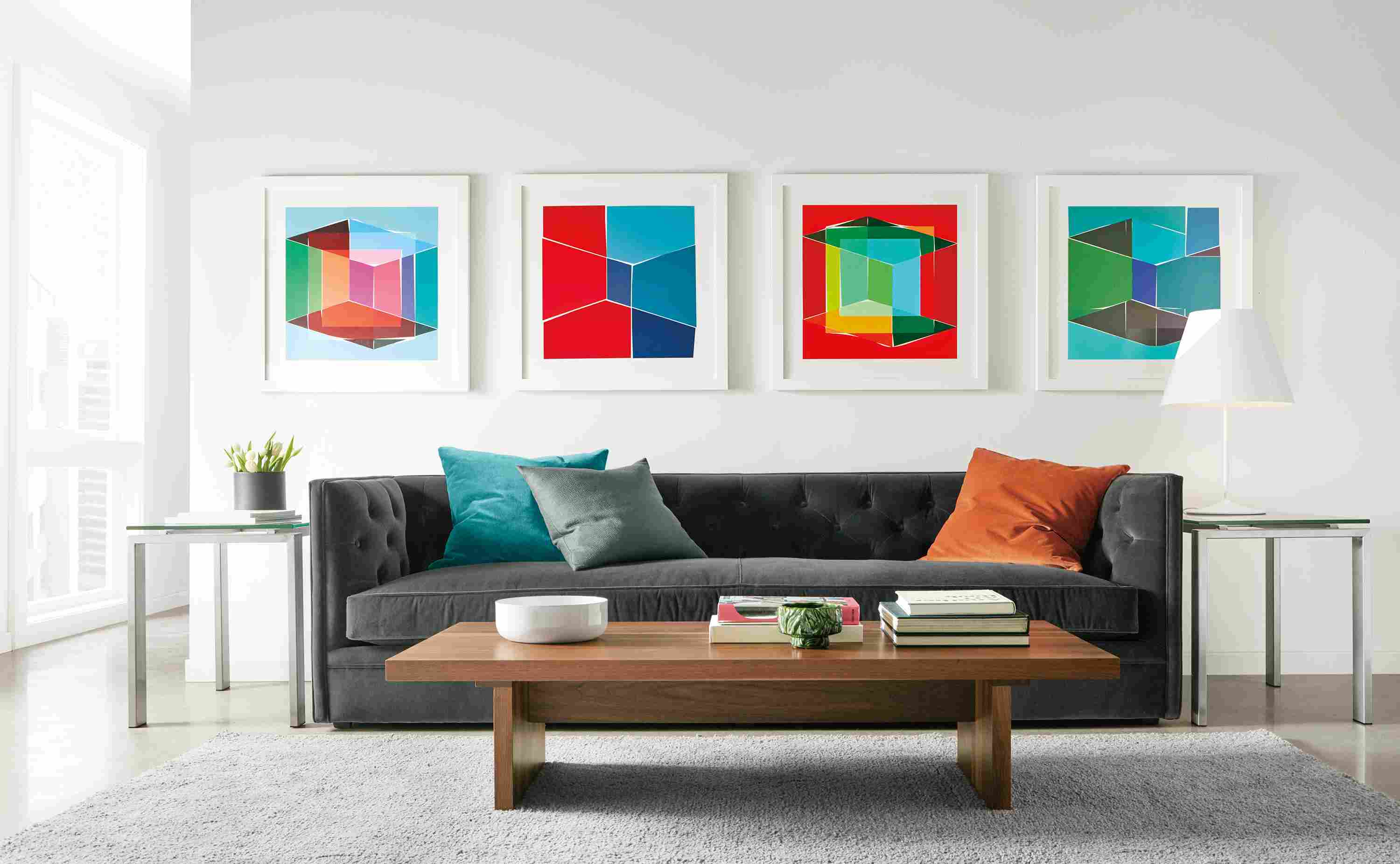 Four Henri Boissiere silkscressns above sofa.