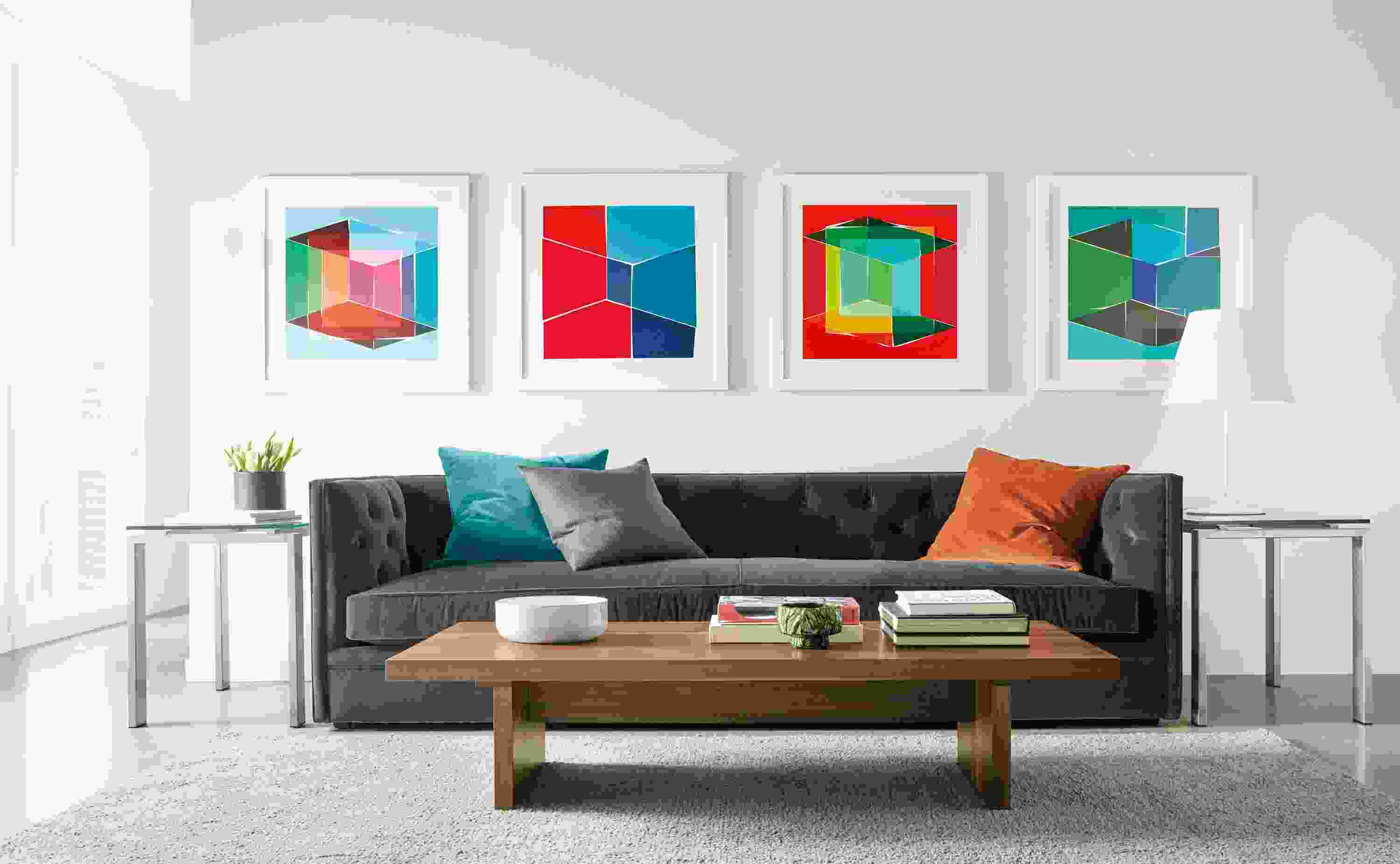 Four Henri Boissiere silkscressns above sofa.